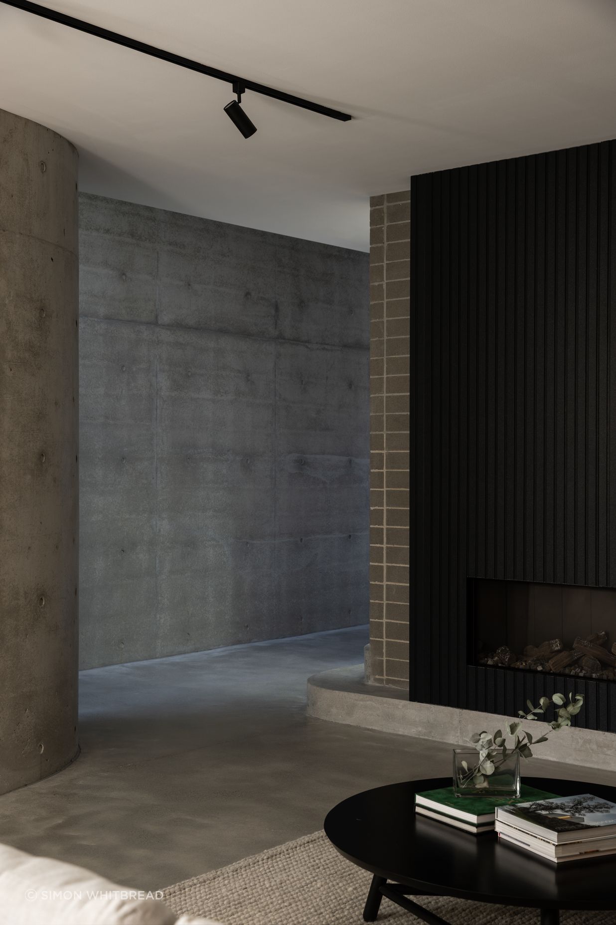 Monochromatic greys and robust materials line the downstairs.