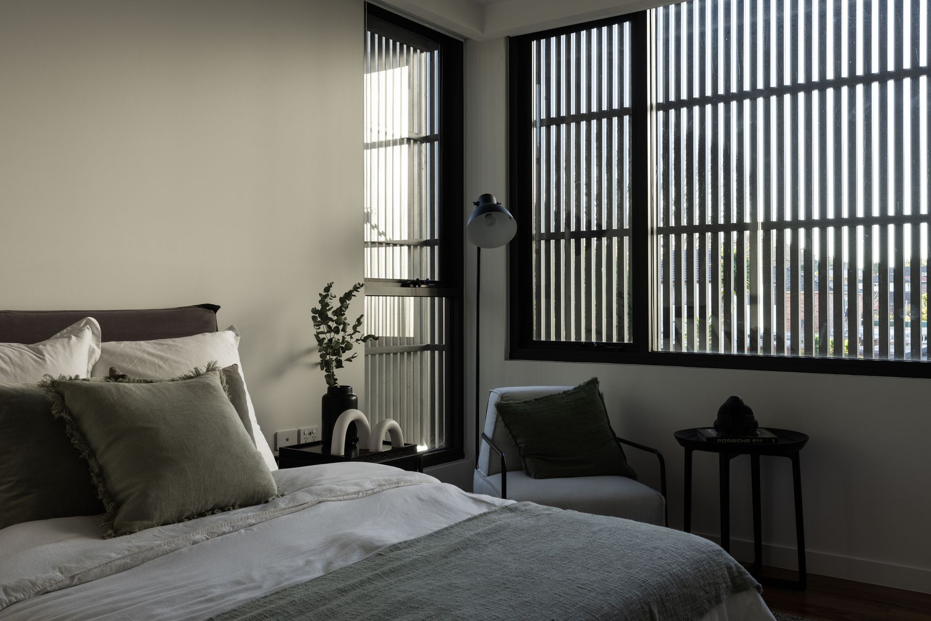 Inside, the blinds add interest to the main bedroom.