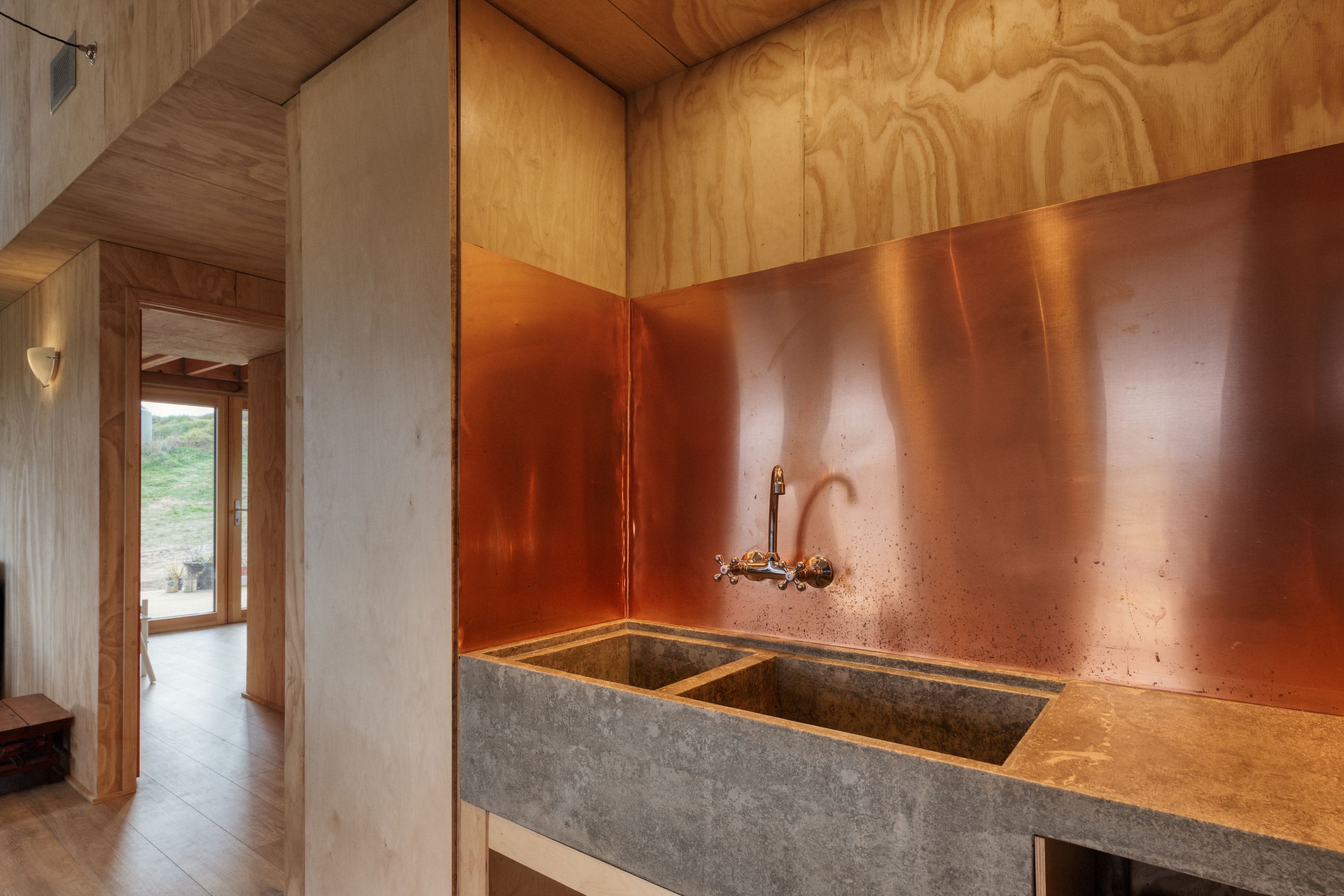 The concrete sinks that Joseph cast himself are modelled after a large butler’s sink in the farmhouse where he grew up in the Yorkshire Dales. “I designed the big bowl with enough room to wash big roasting tins because we love a good roast.”