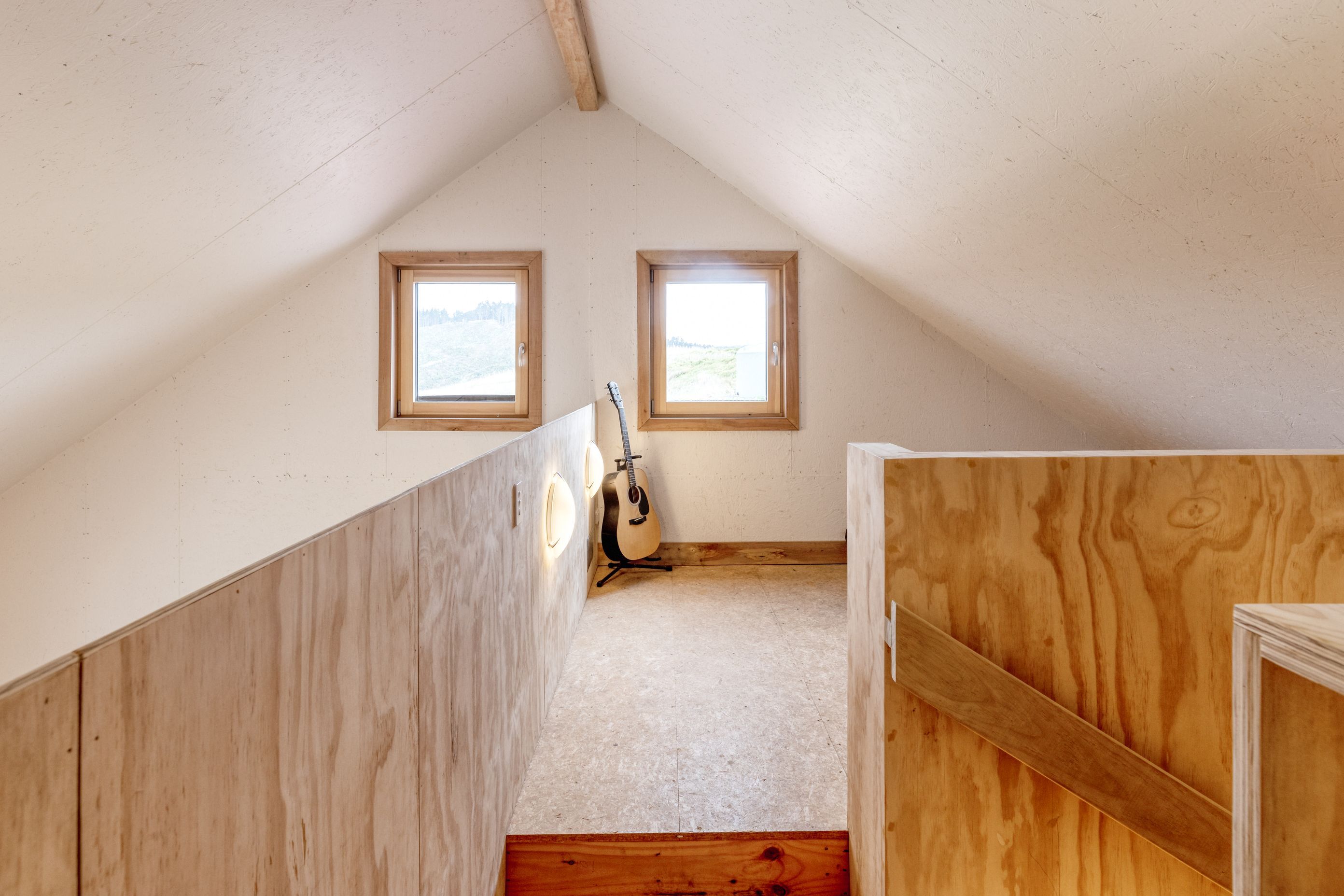 The multi-purpose mezzanine is currently used by the family as a music room.
