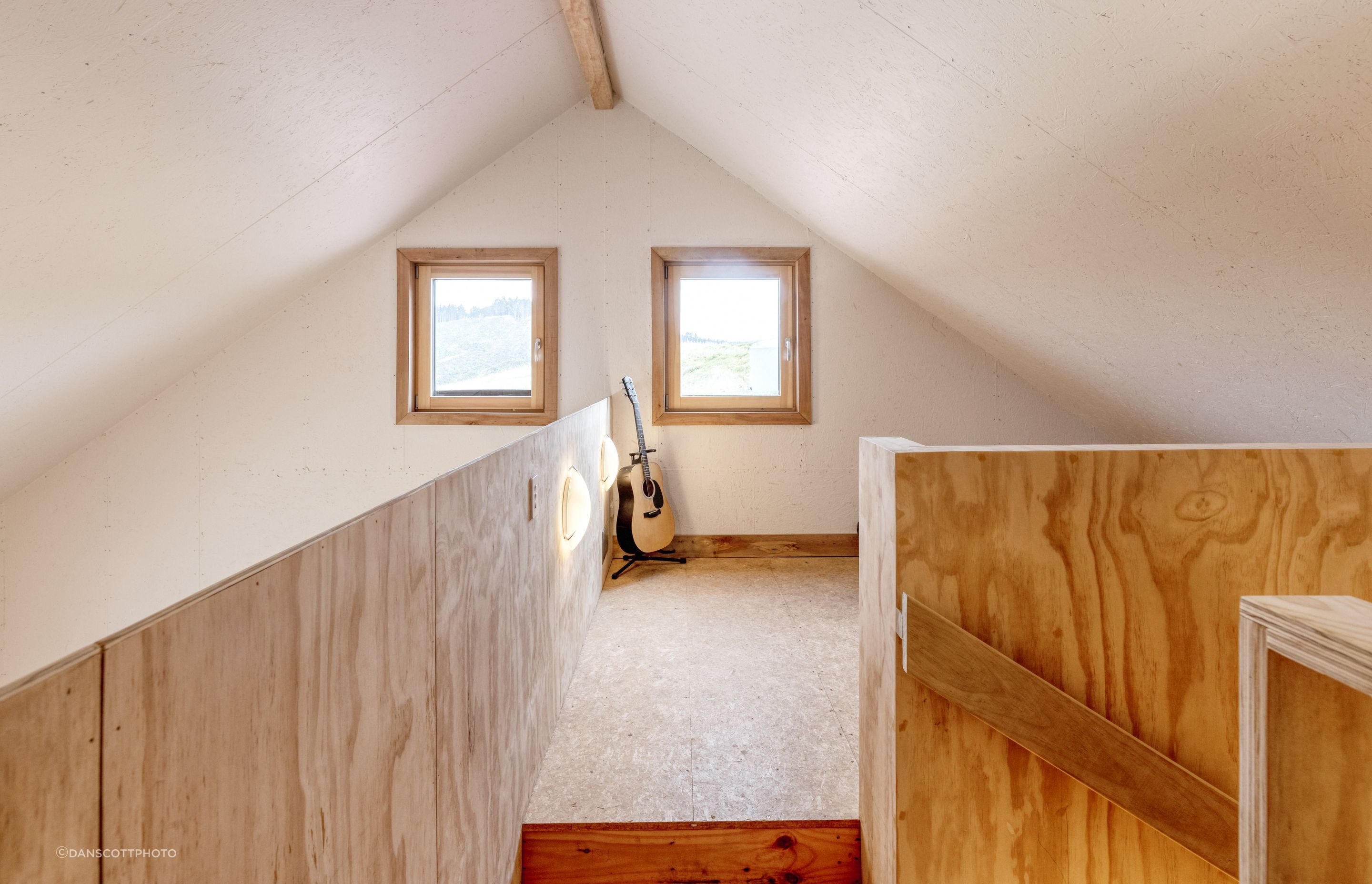 The multi-purpose mezzanine is currently used by the family as a music room.