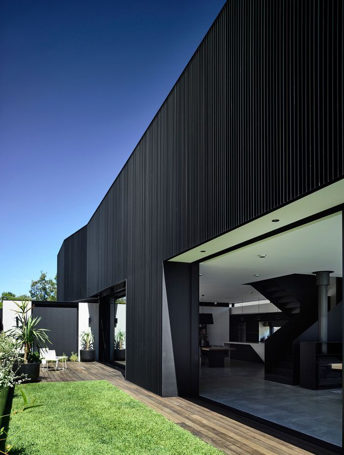 Large openings connect to the outdoor spaces seamlessly.