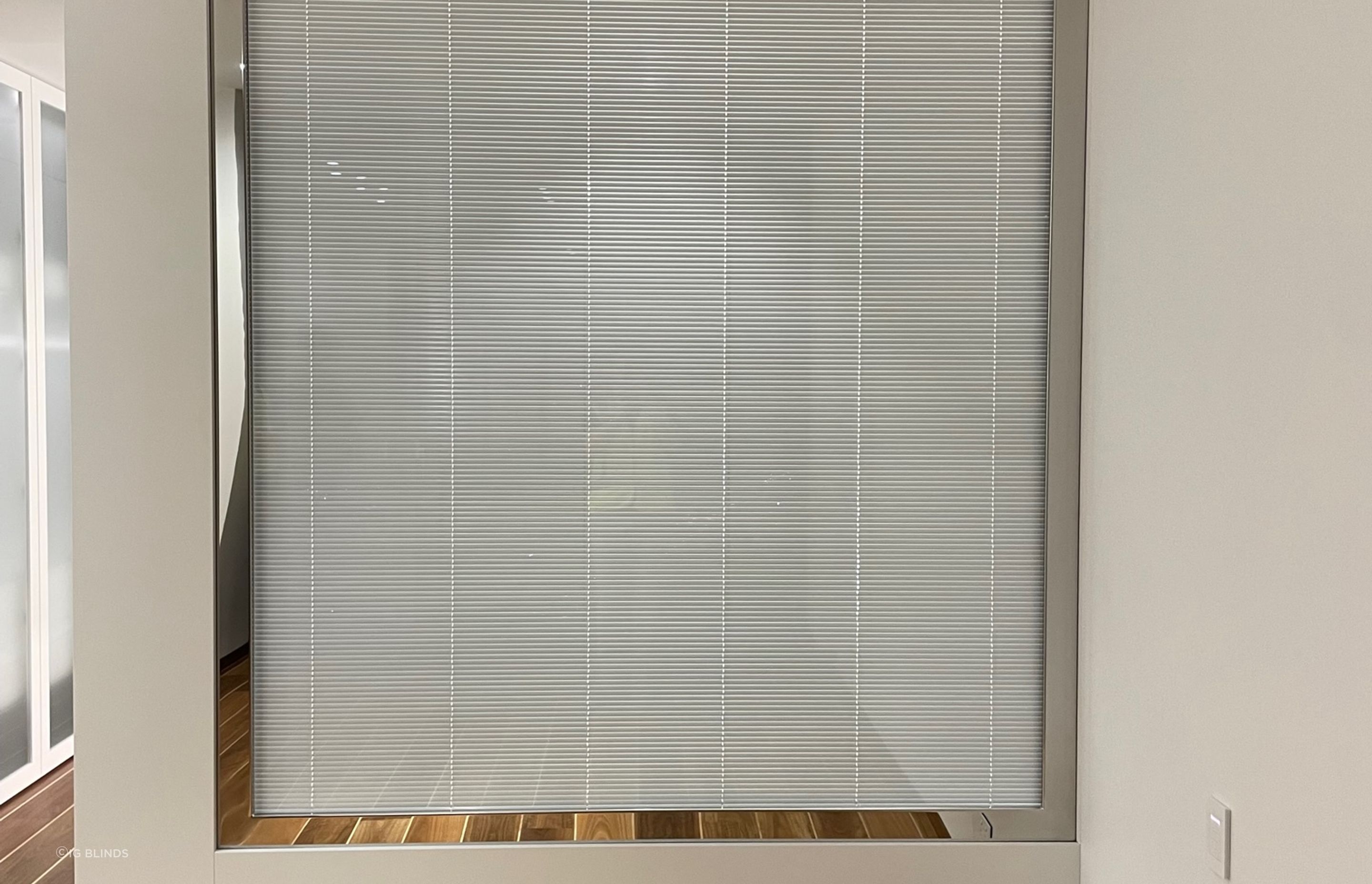 The bespoke double-glazed window system features an integrated Venetian blind and fully automated controls, allowing users to easily adjust for light and privacy. Completely air and water-tight, the internal blind remains clean and dust-free; the double-glazing reduces humidity and temperature changes within the apartment — even after a hot, steamy shower.