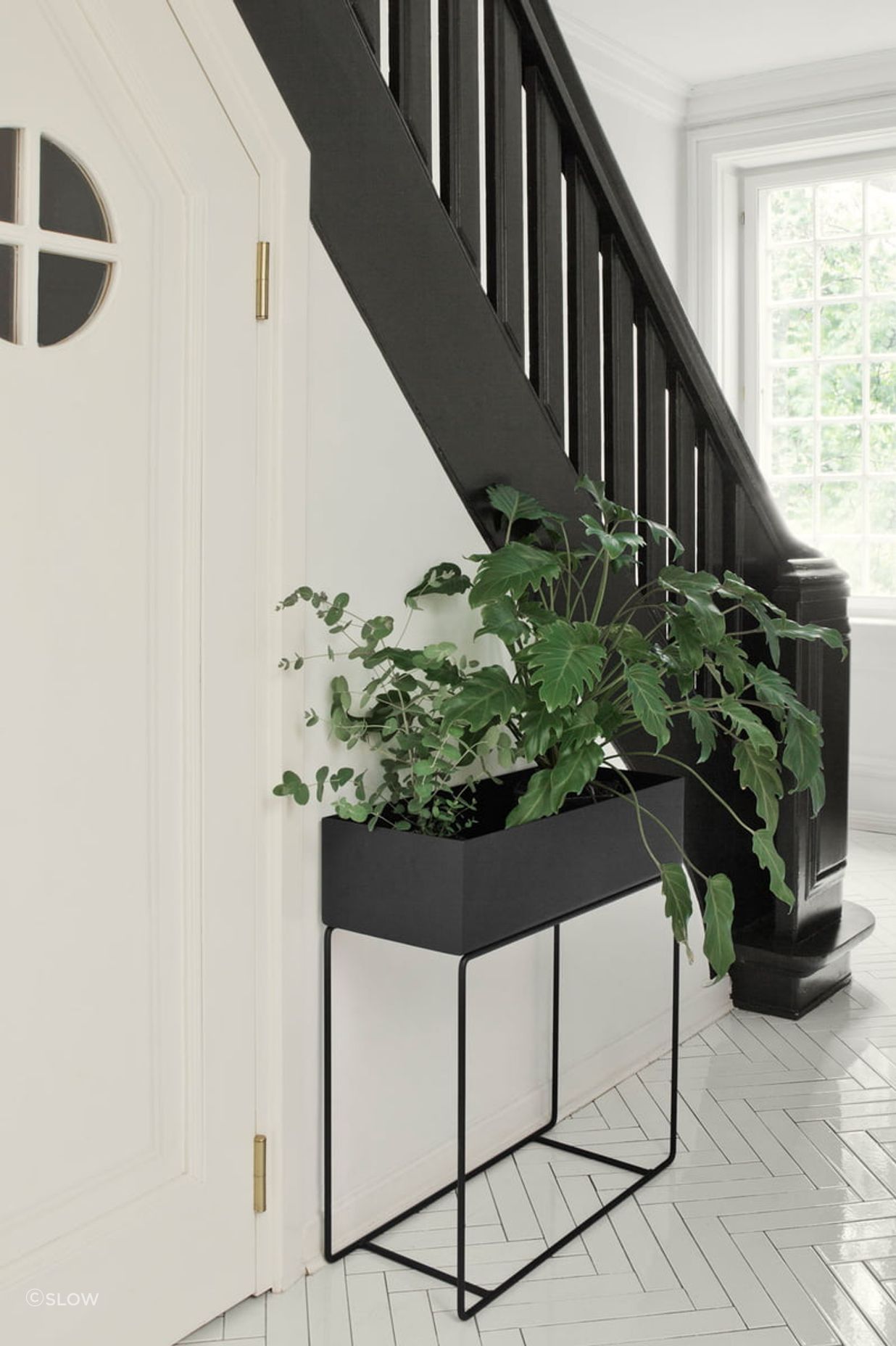 With planter boxes like this black steel model from SLOW, nature can easily be brought inside. 