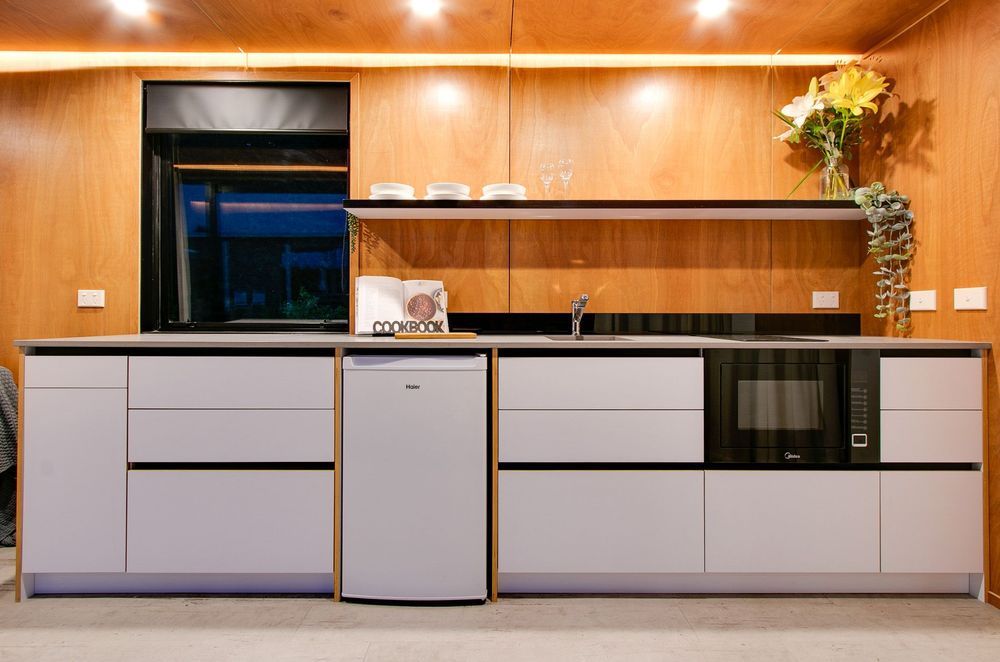 The galley-styled kitchen was the perfect solution to the rectangular shape the designers were working with