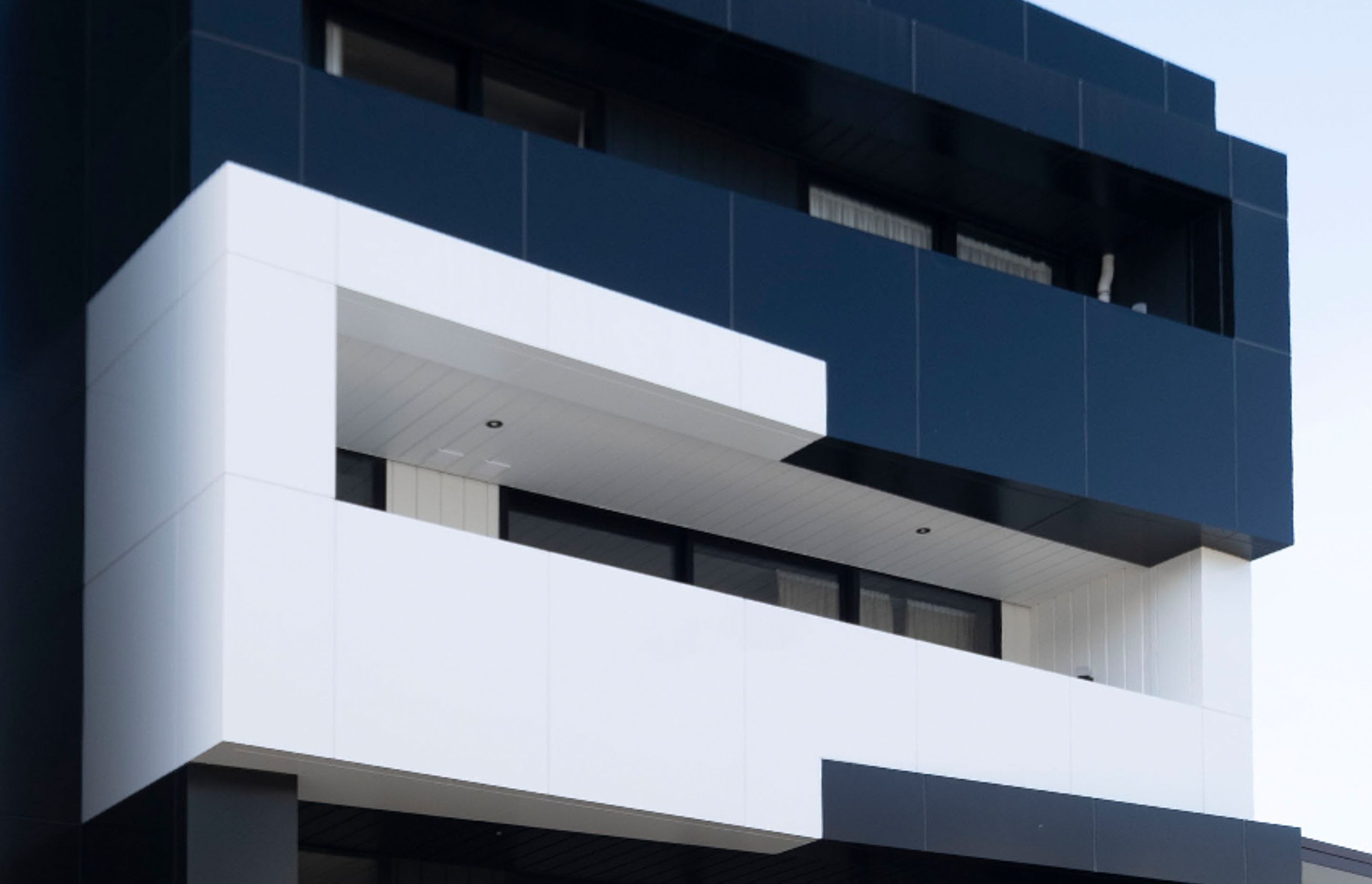 Panelux Solid Aluminium, seen here in black and white options on the Blake St Apartments, Ponsonby, is non-combustible and fully compliant with the NZBC for all commercial, industrial, residential and high rise construction.