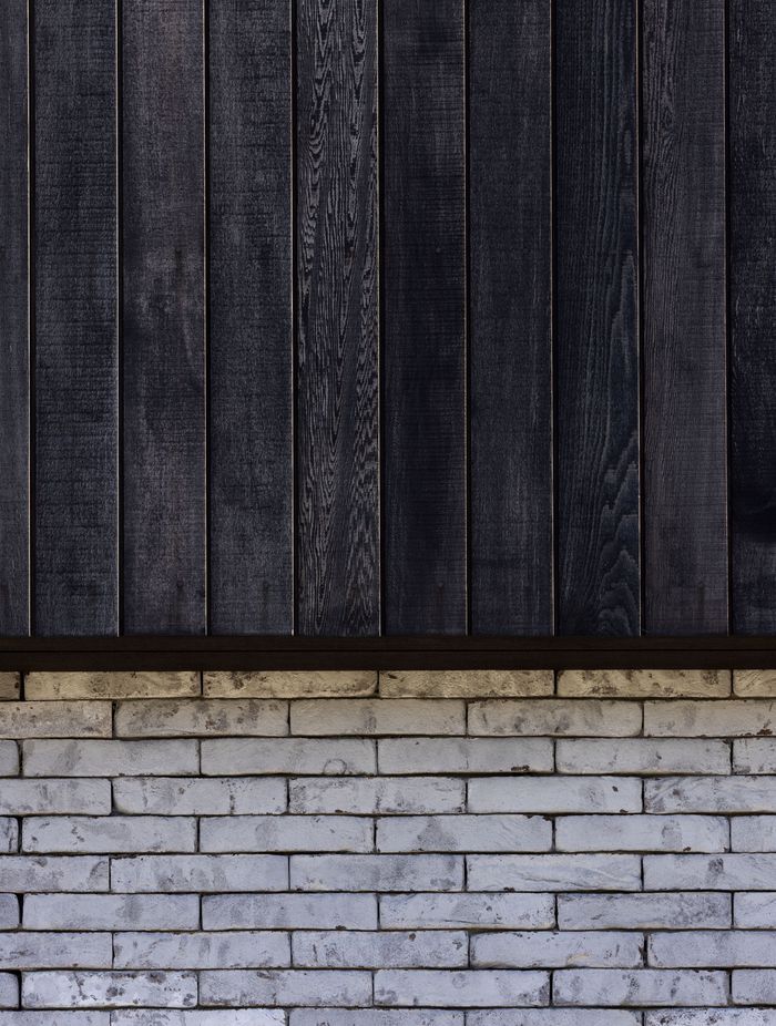Contrasting textures and tones of Pitau's exterior