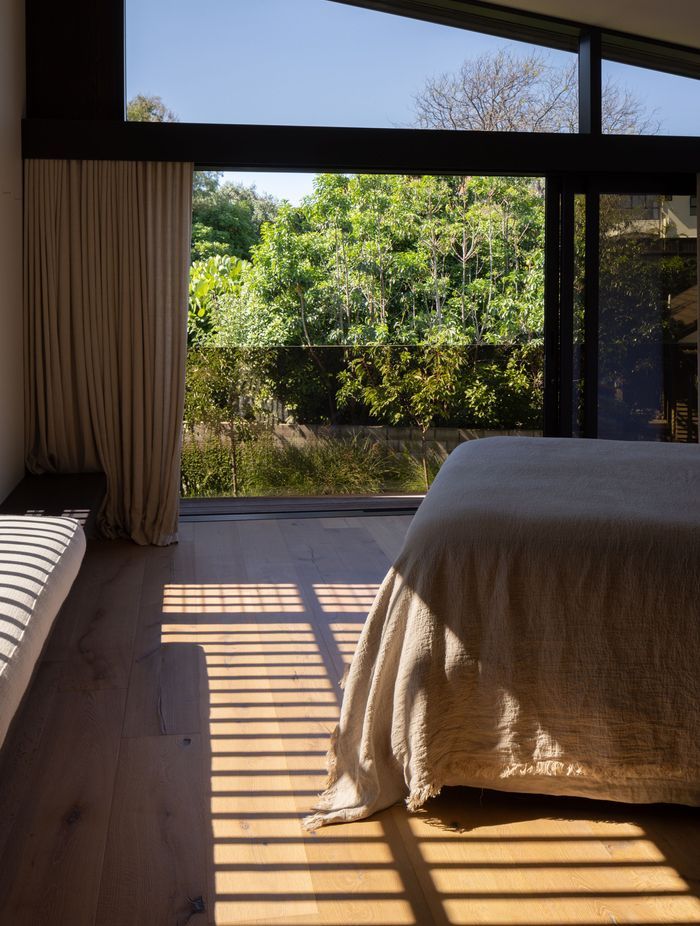 Natural linens work with timber in the 'Master Retreat'