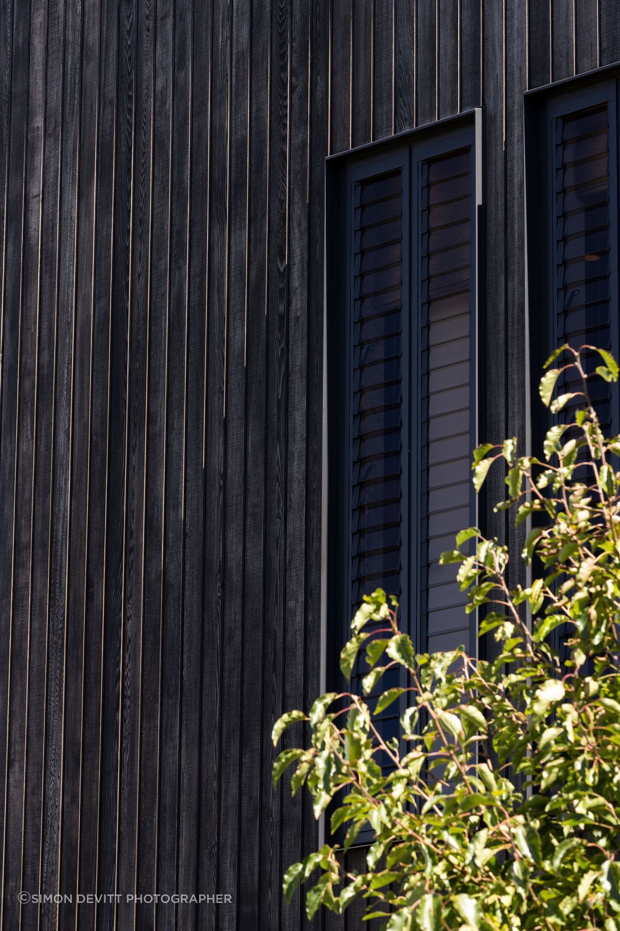 Custom shiplap cedar cladding by Rosenfeld Kidson & Co.