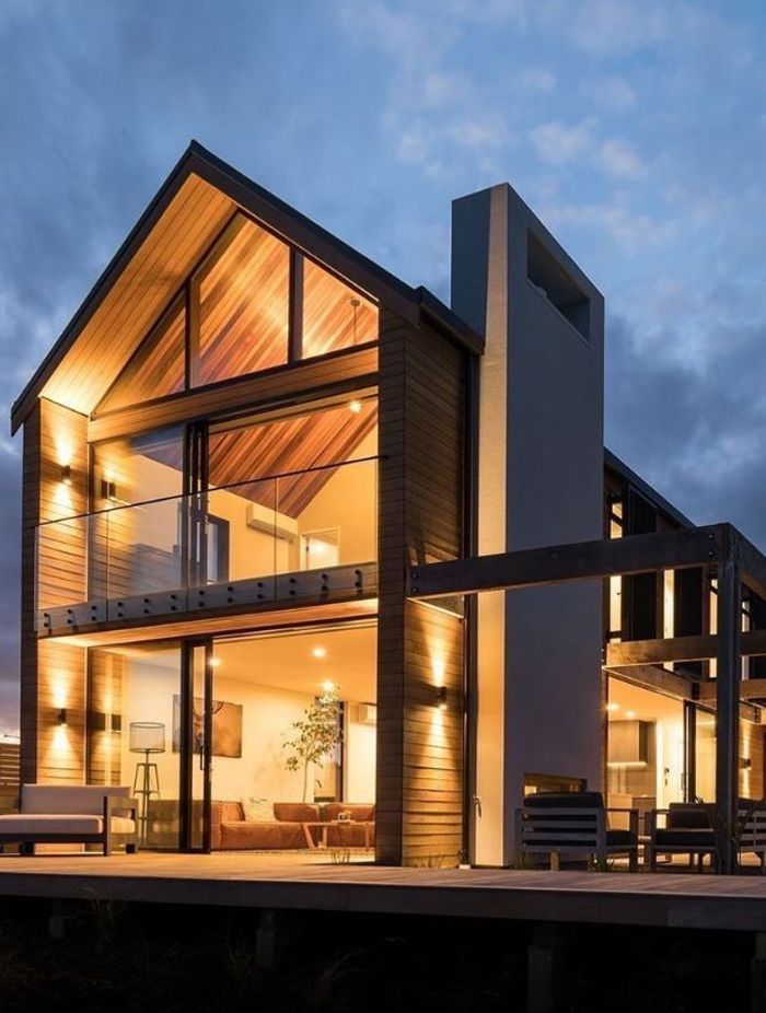 Pro-Spec Electrical enhanced this home's backyard exterior with meticulously chosen architectural lighting, embracing depth and dimension through the use of Up/Down lighting.