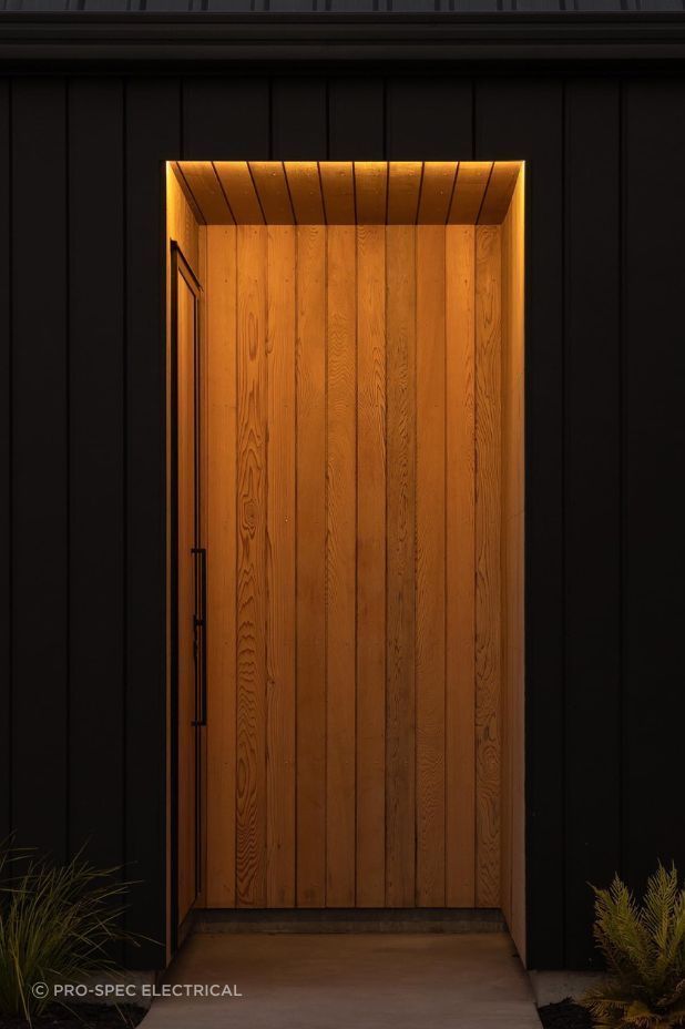 The client requested a lighting design that kept the entryway discreet whilst highlighting the beautiful cedarwood for this Riverhead home.