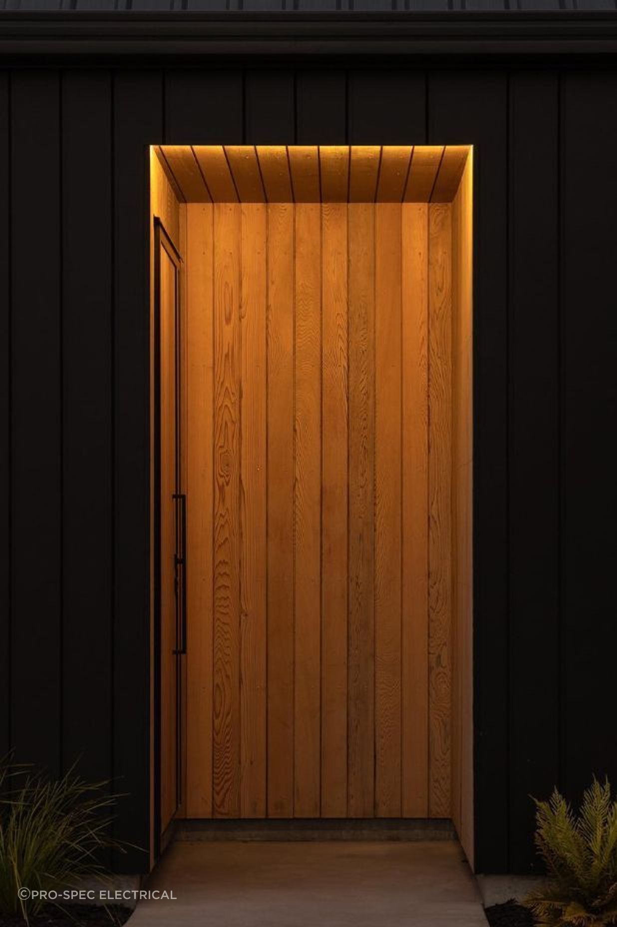 The client requested a lighting design that kept the entryway discreet whilst highlighting the beautiful cedarwood for this Riverhead home.