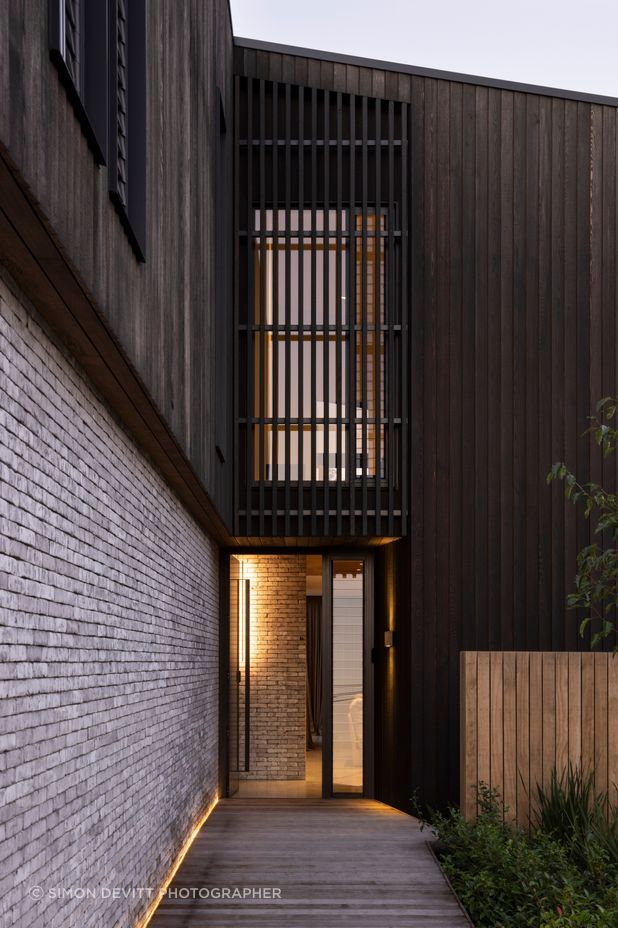 Custom cedar cladding and bricks work in harmony
