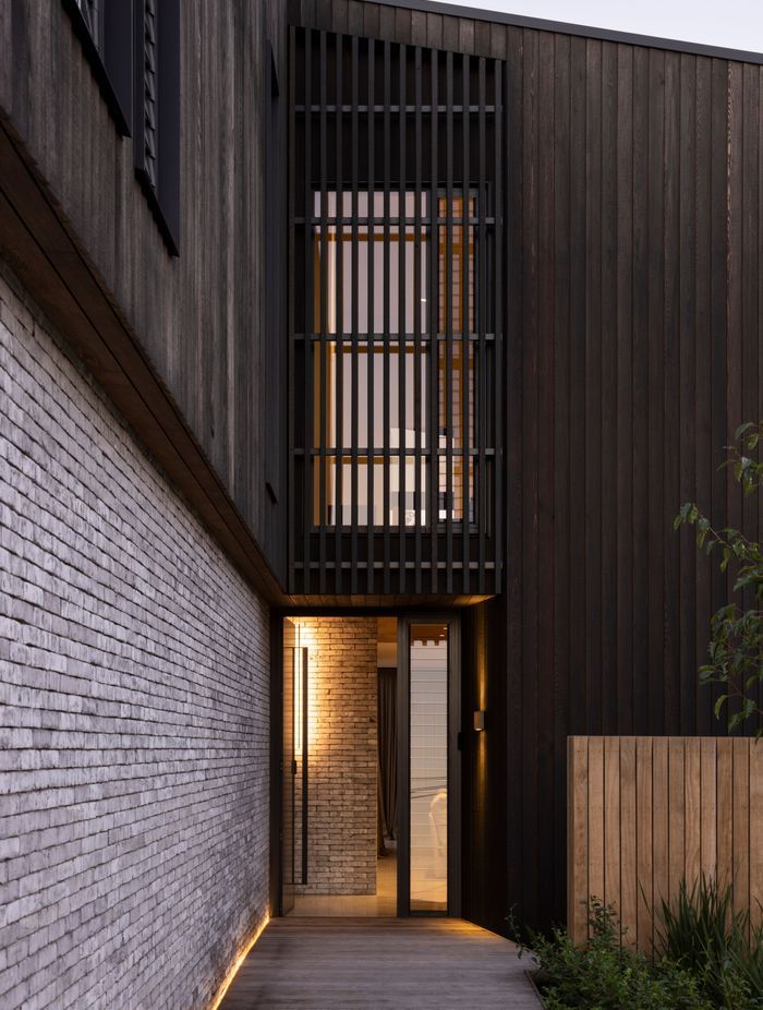 Custom cedar cladding and bricks work in harmony