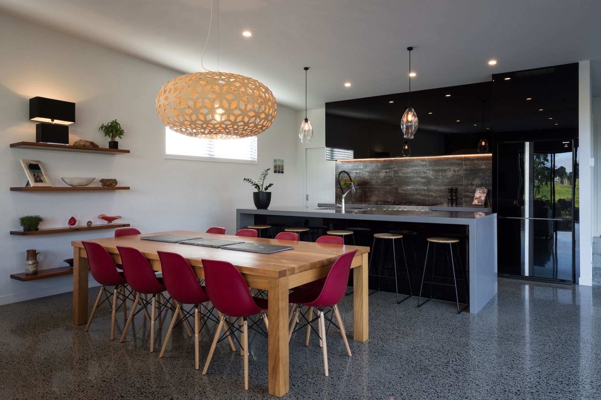 A concrete slab and polished floors with high thermal mass help the home absorb energy from the sun. Photo: Mark Scowen.