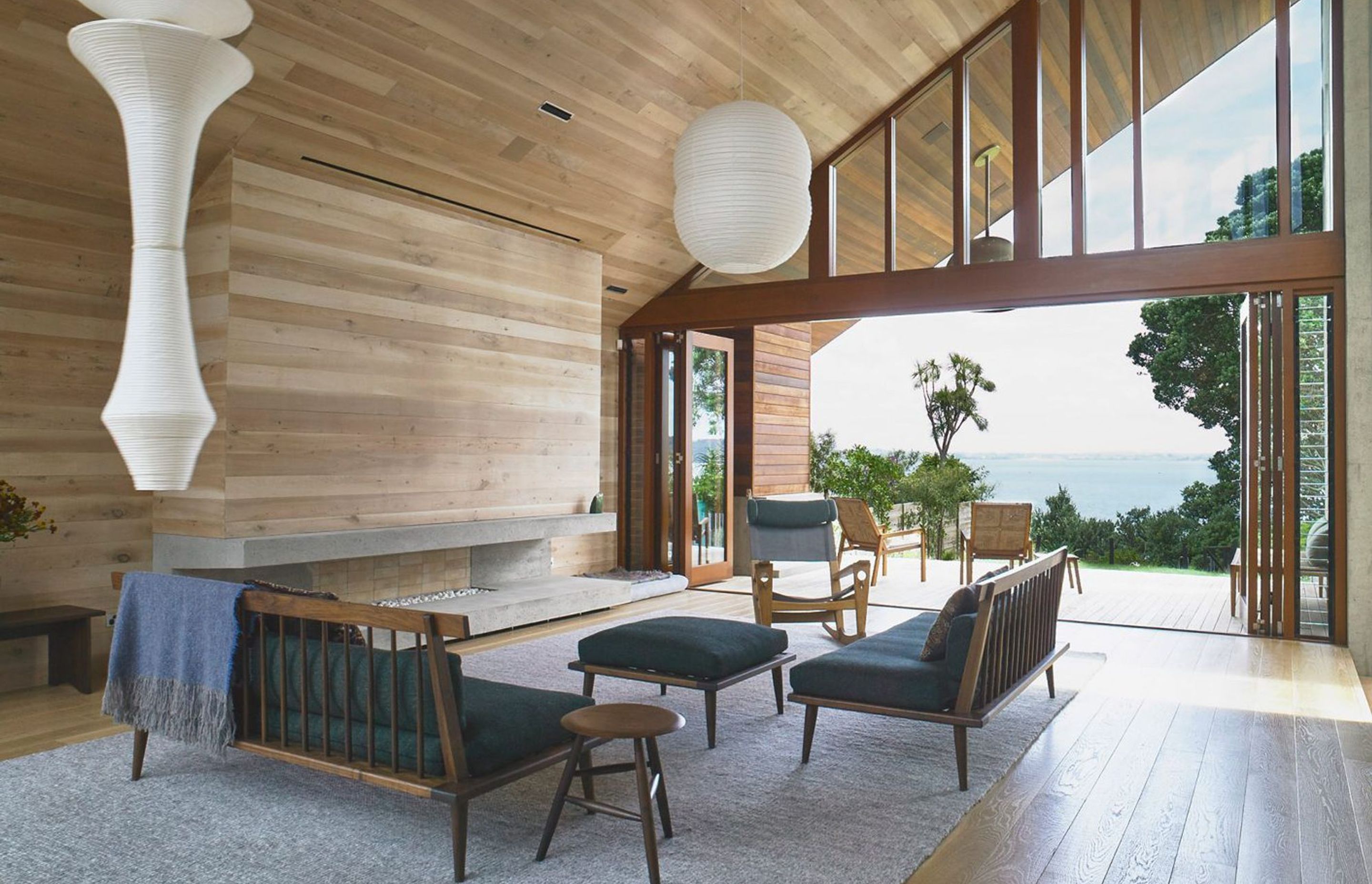 At Rawene House by Stevens Lawson Architects, timber-panelled walls merge into ceilings and floors, creating beautiful warm and flowing spaces―a peaceful haven in the city. Photograph by Mark Smith.