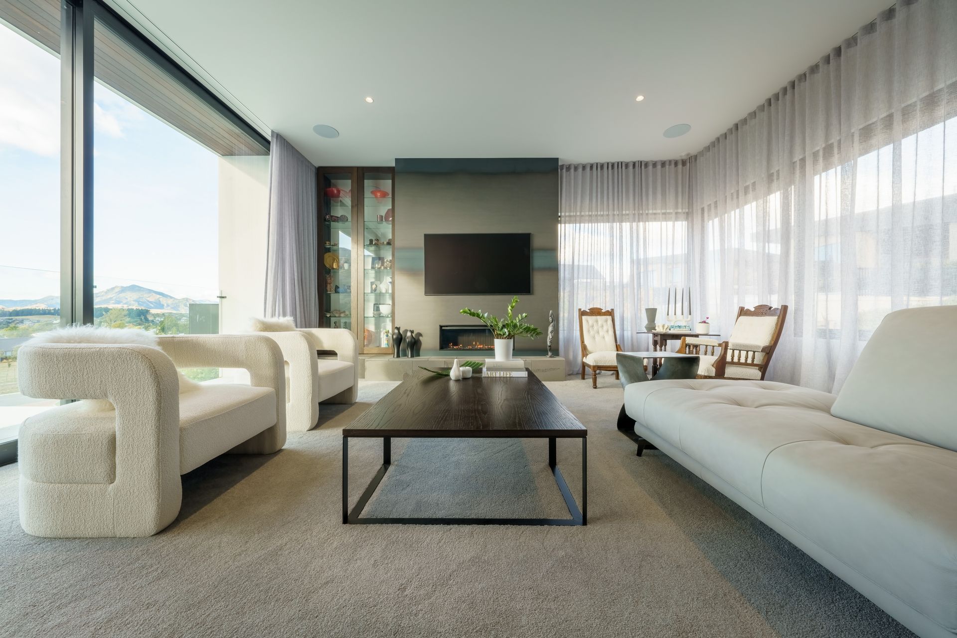 The fireplace featuring flamed blue steel