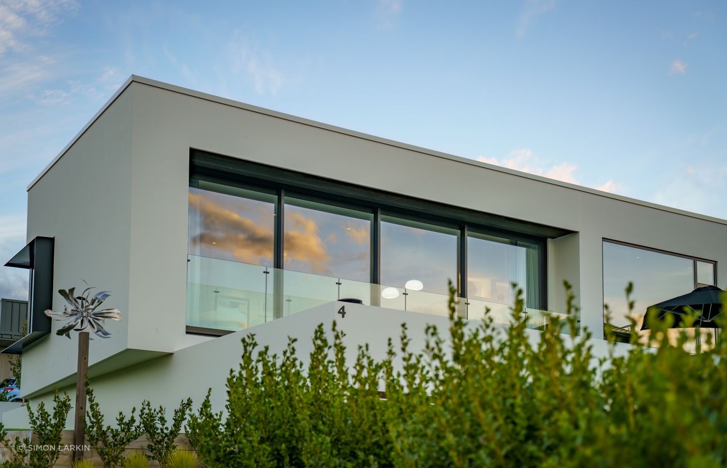 The cantilevered level of the home draws an interesting frame