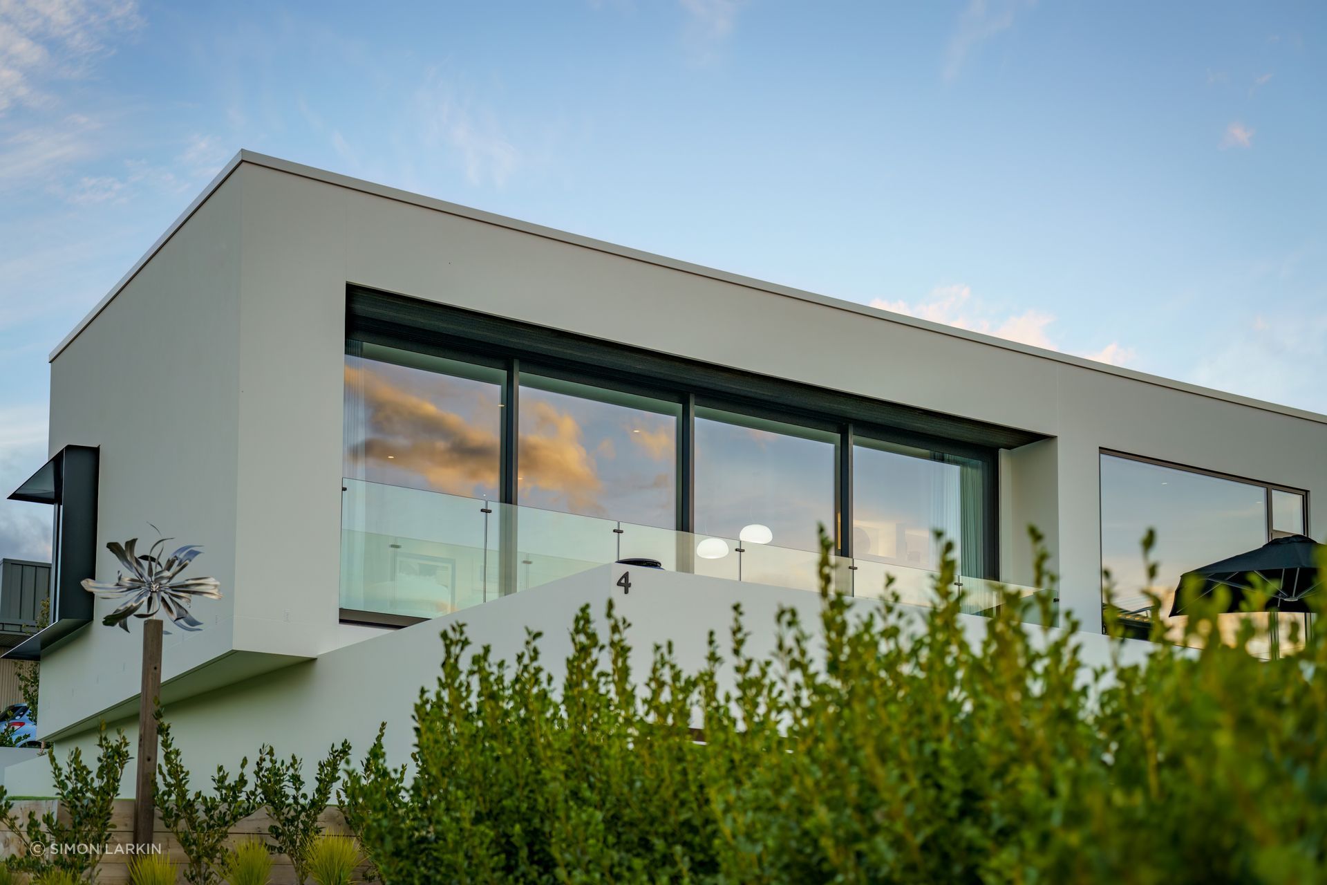 The cantilevered level of the home draws an interesting frame