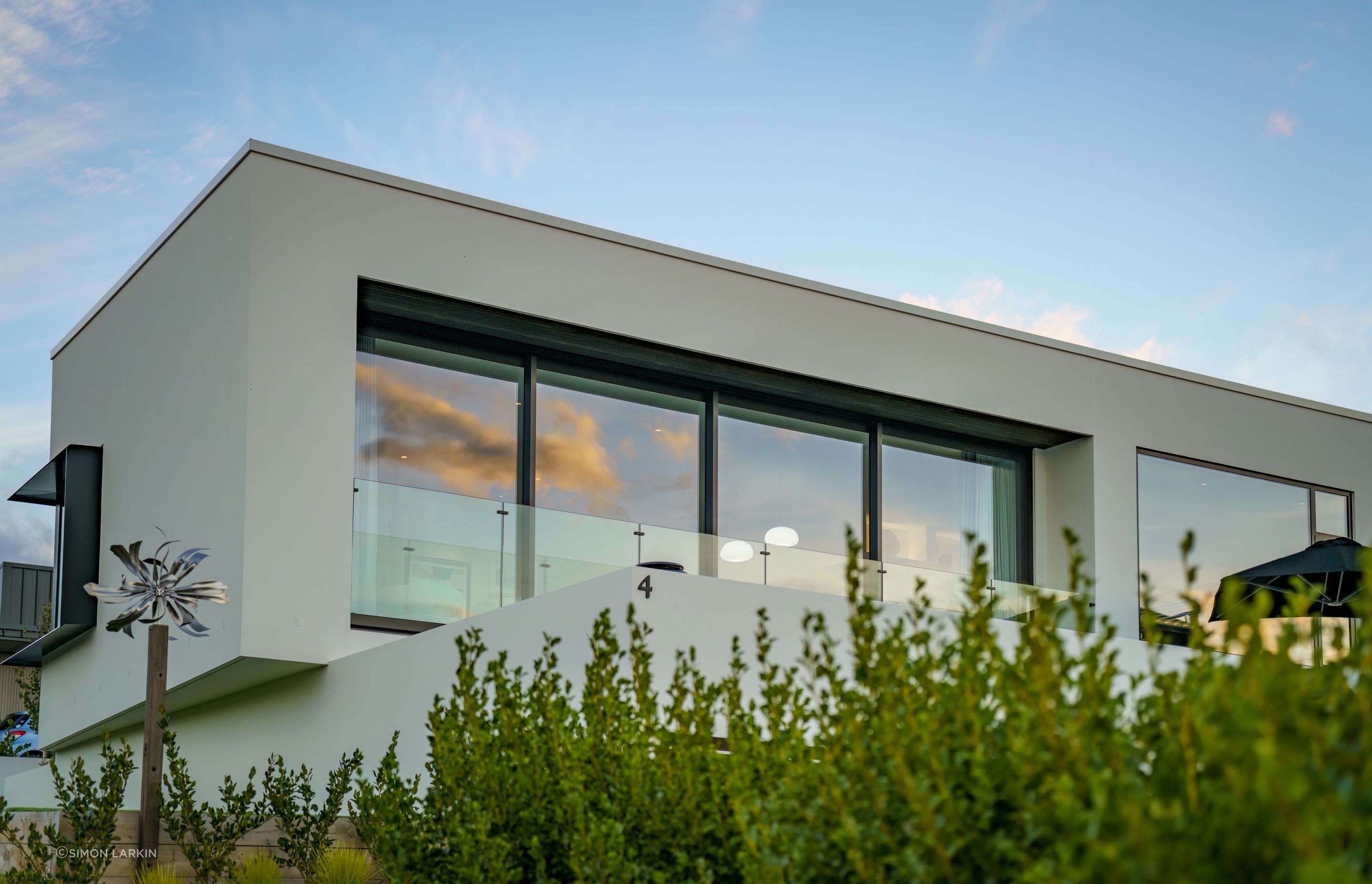 The cantilevered level of the home draws an interesting frame