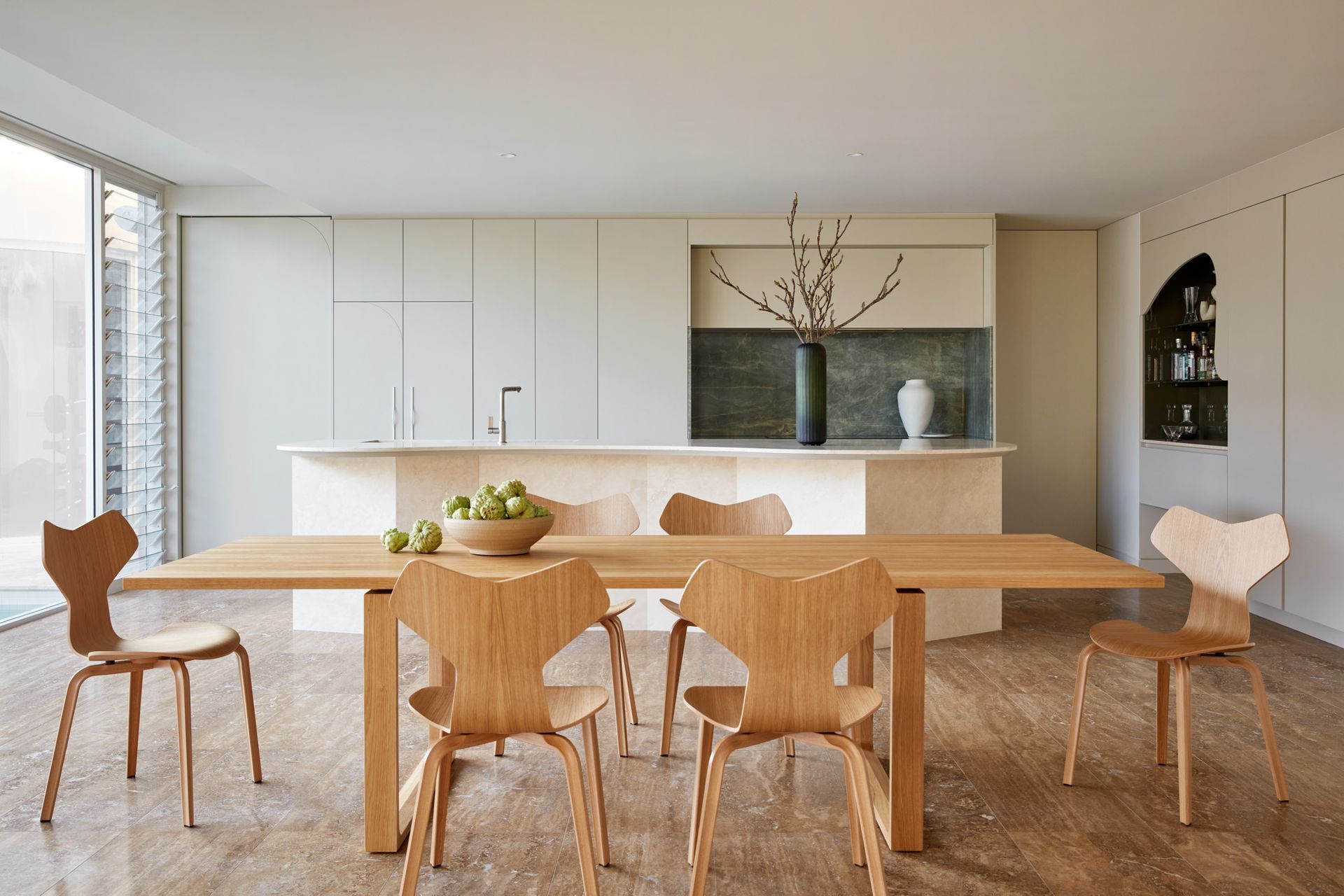 Natural light cascades into windows and skylights throughout the space, illuminating the meticulously curated interior.