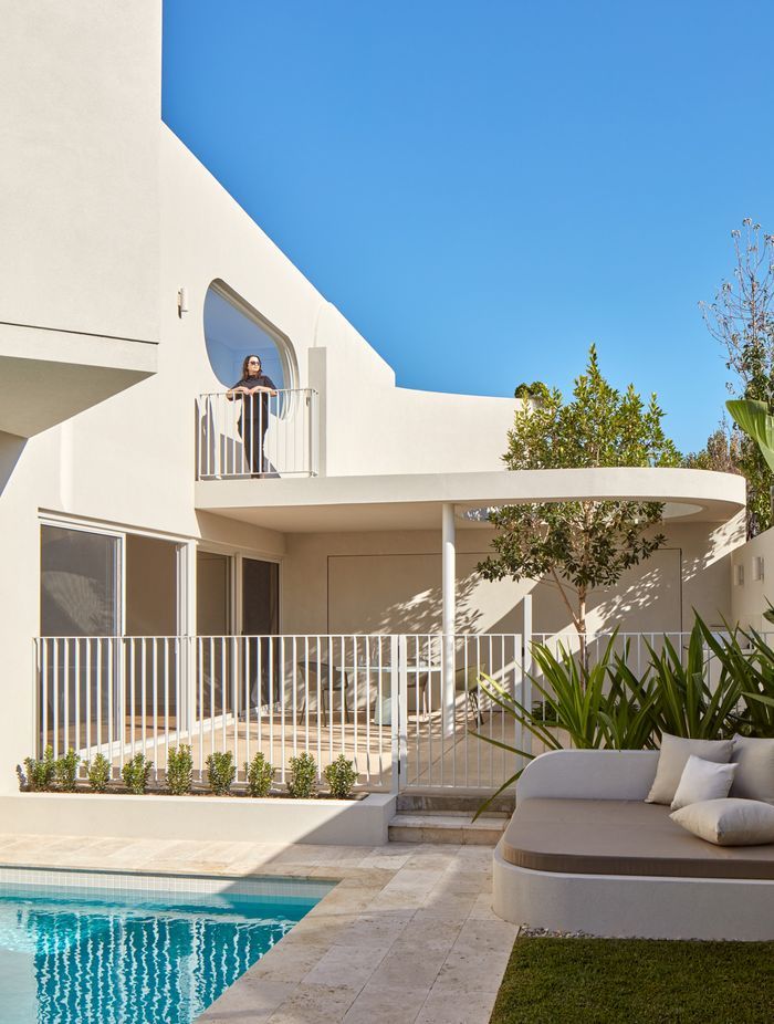 The home unfolds across split levels, each designed for effortless entertaining.