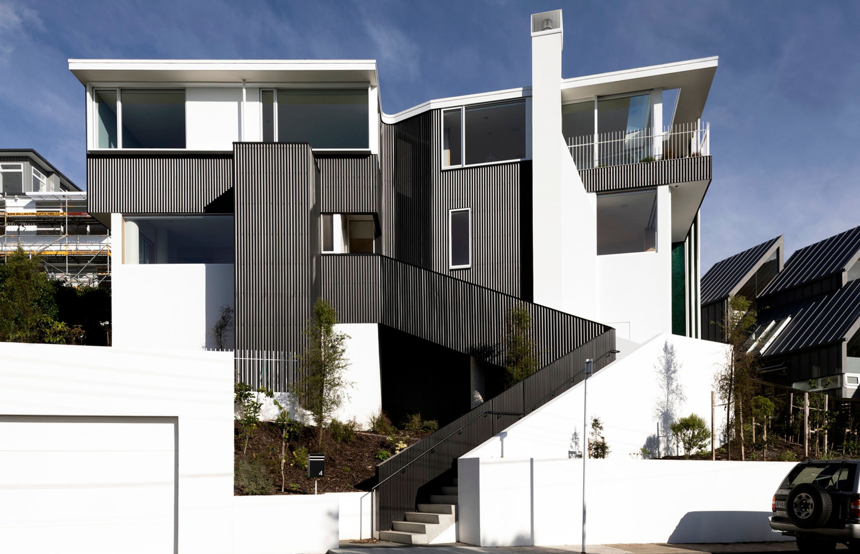 Parsonson Architects' Salmont Place project is a very modern renovation that utilises the existing concrete structure of a two-storeyed 1950s house and transforms it into two cleverly laid-out apartments overlooking Wellington harbour. Photograph by David