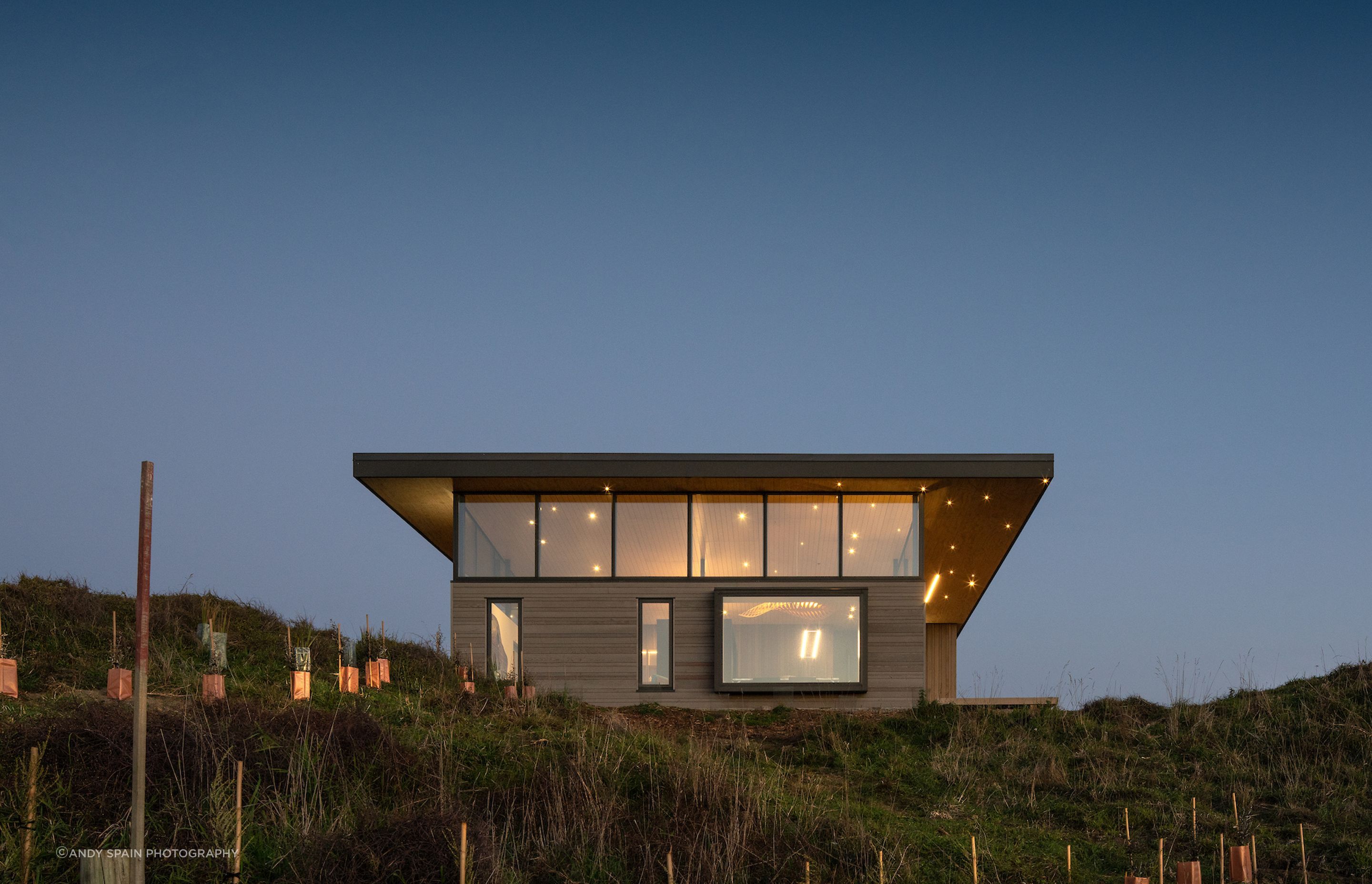 The soffit and ceiling at Te Horo House is irregularly dappled with spotlights that resemble the stars in the night sky.