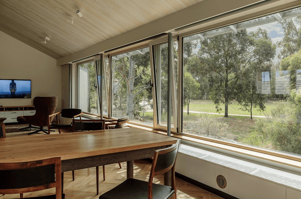 Pine ceilings add a textural element, while strategically placed lighting imbues a comfortable and inviting ambience, particularly during the night.