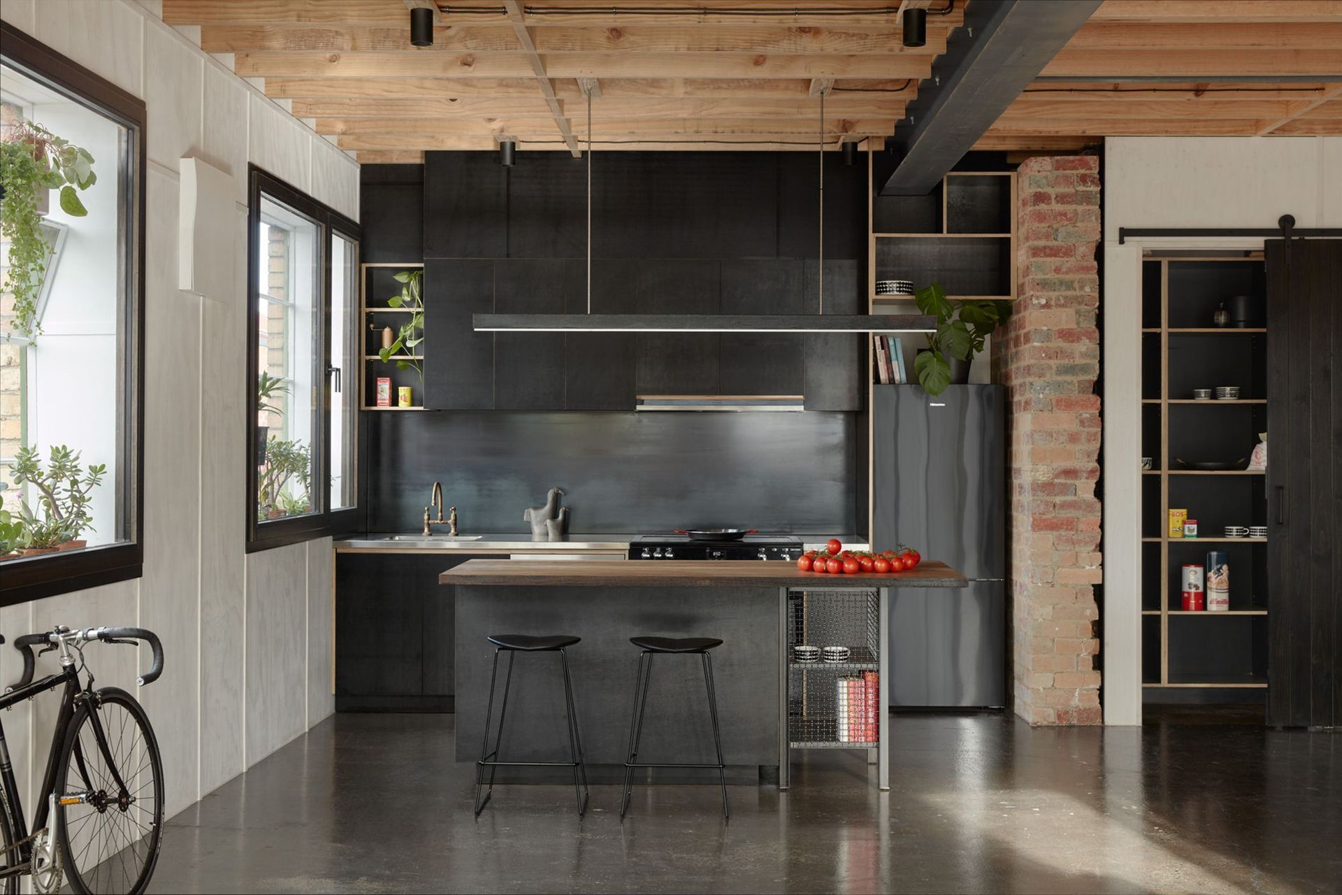 Great care was taken to retain the embodied energy of the structure, celebrating its original form and integrating this into a series of new, functional spaces for a growing family unit.
