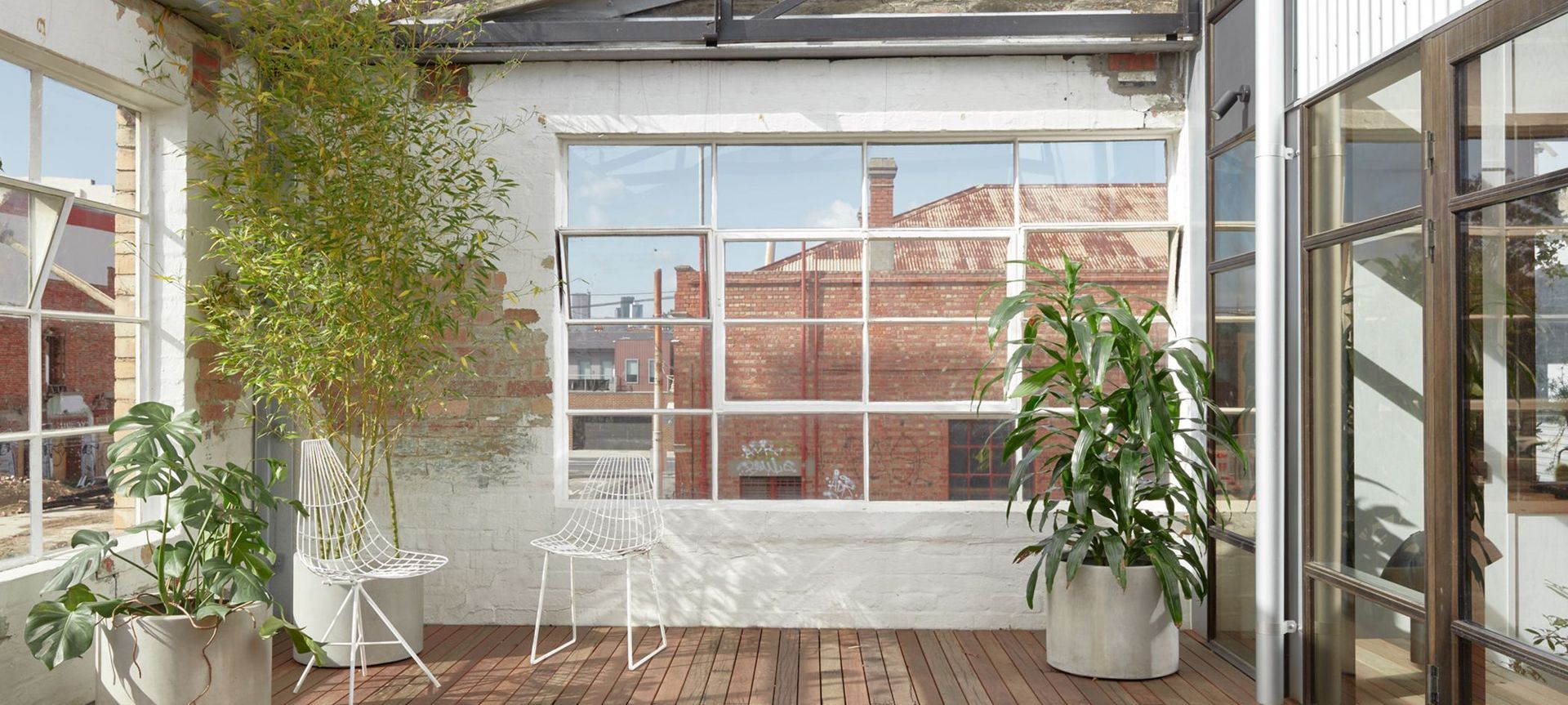 Warehouse Greenhouse portrays the thoughtful storytelling of a home's industrial past and conscious future.