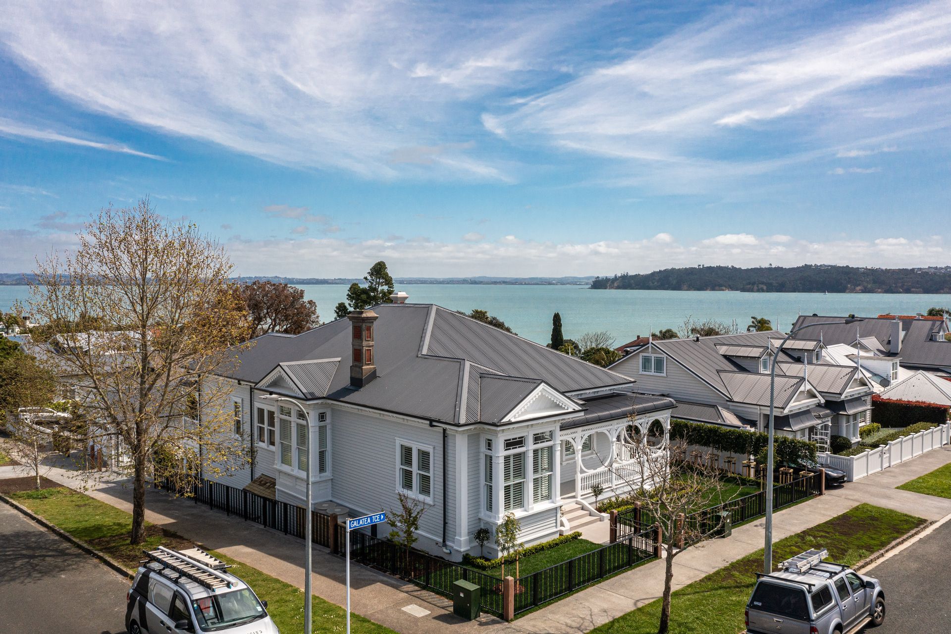 The villa sits stately on an 817-square-metre corner block with breathtaking water views.