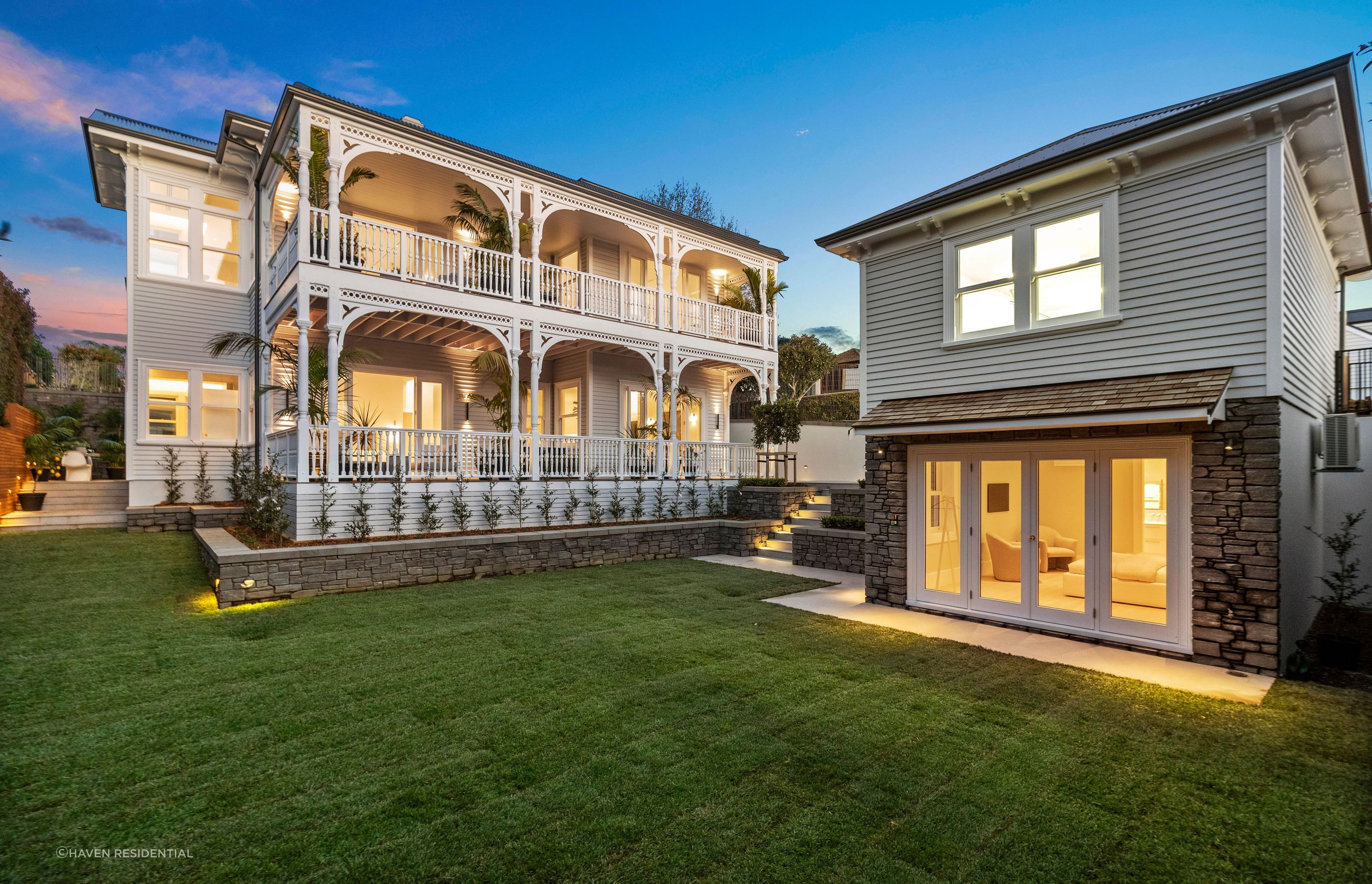 The addition of garden hardscaping, including concrete planters, blends the outdoor space with the surrounding landscape.