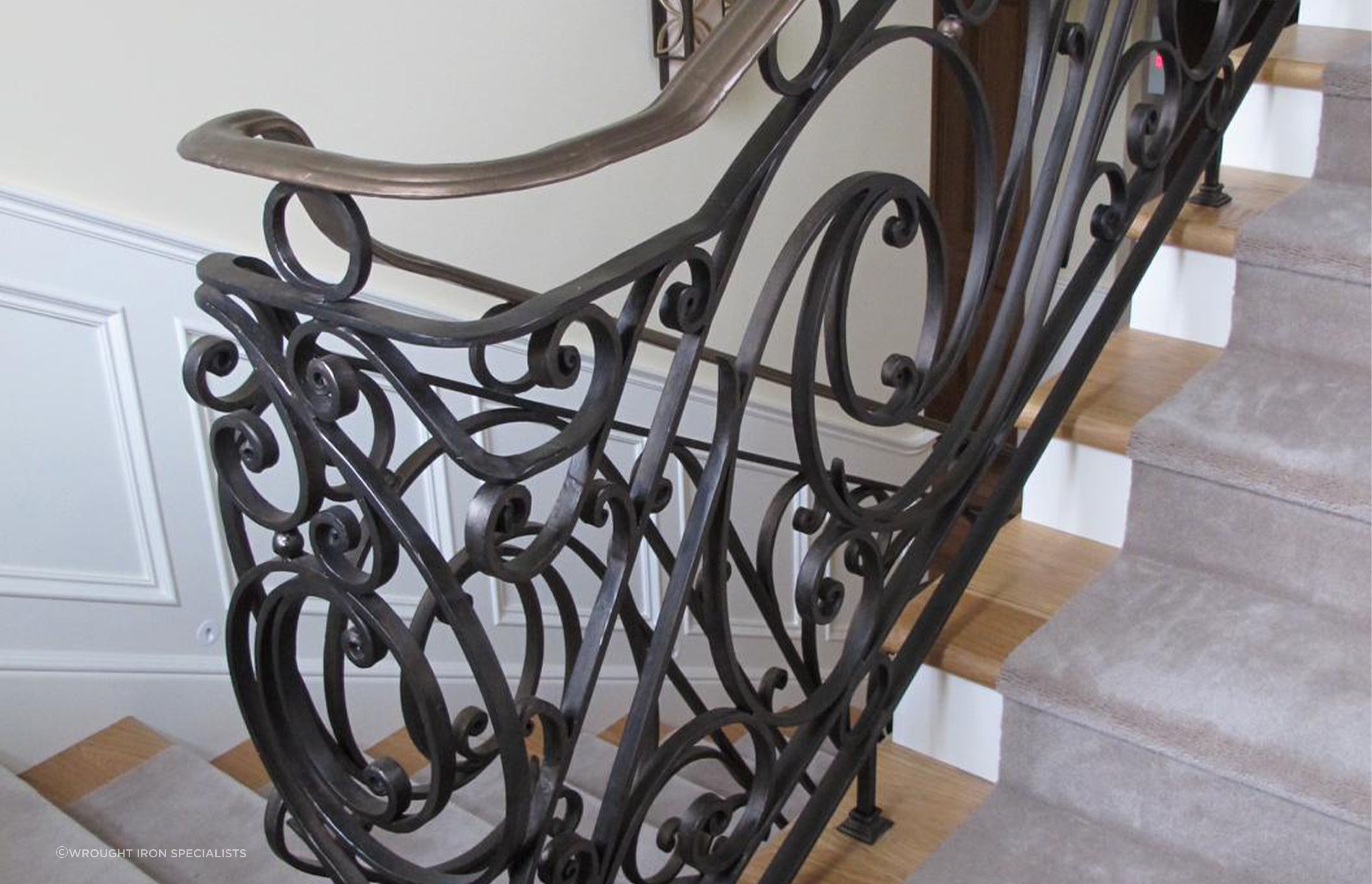 Features that take inspiration from organic shapes, like this custom balustrade from Wrought-Iron Specialists, can enhance the feelings of natural connection in the home.