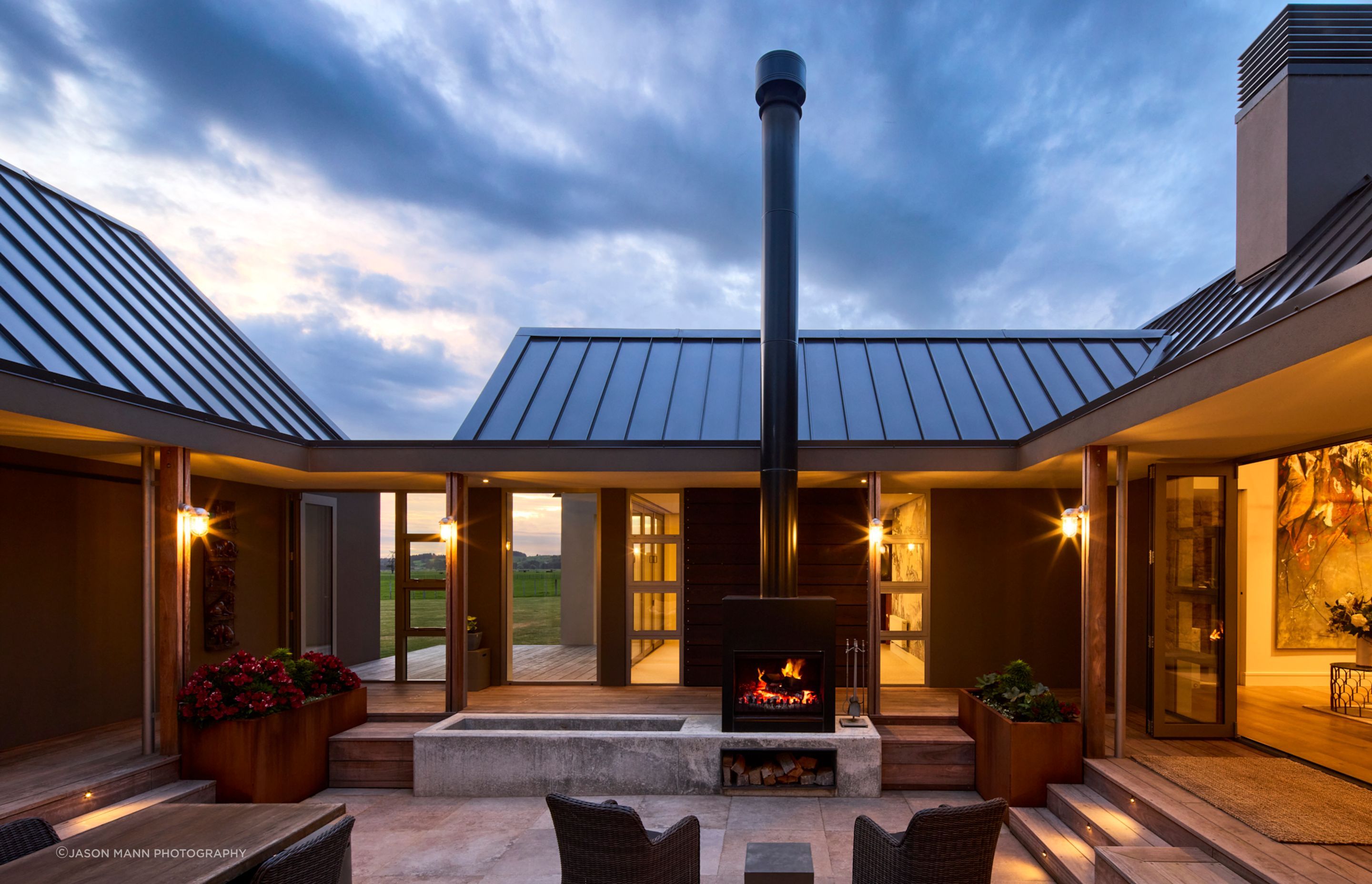 The internal courtyard at the centre of the home provides a sheltered outdoor gathering space, and has peaks through to the farmland beyond.