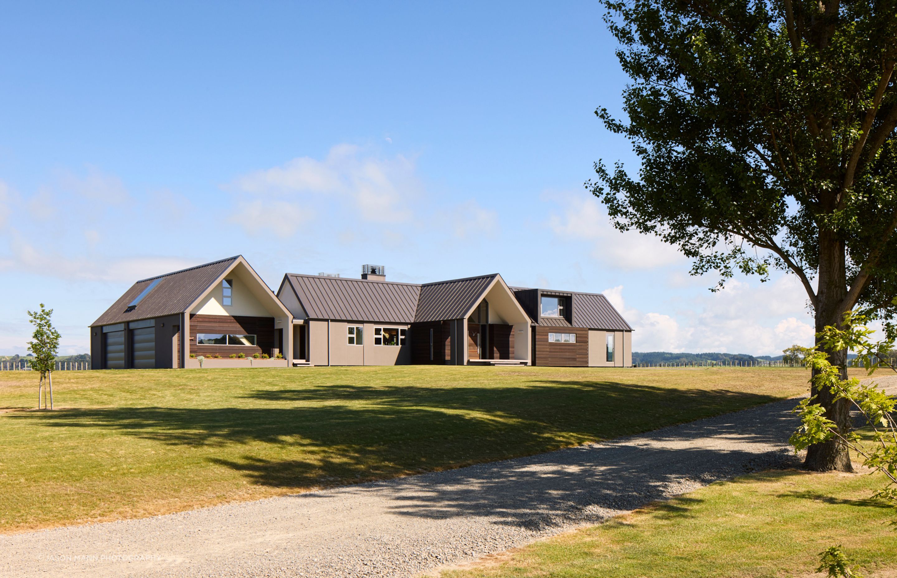 The recessed overhangs at the ends of the gables mean the windows do not simply appear as apertures in the form of the building.