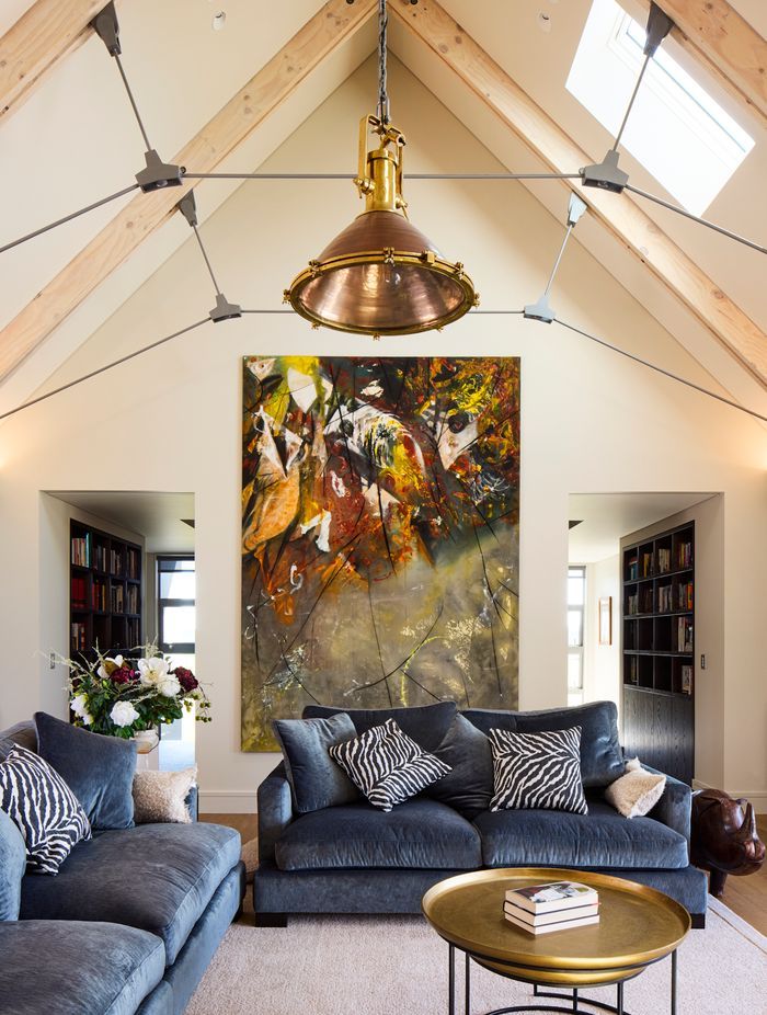 In the interior, the laminated timber beams were left exposed and lightly white-washed, for a raw, agricultural effect.