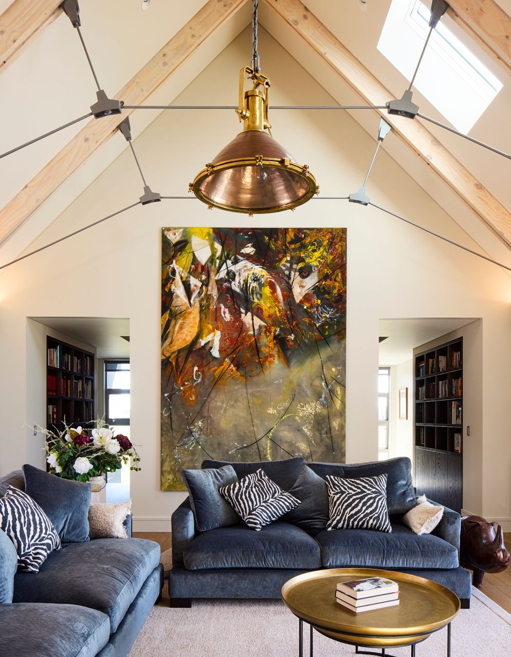 In the interior, the laminated timber beams were left exposed and lightly white-washed, for a raw, agricultural effect.