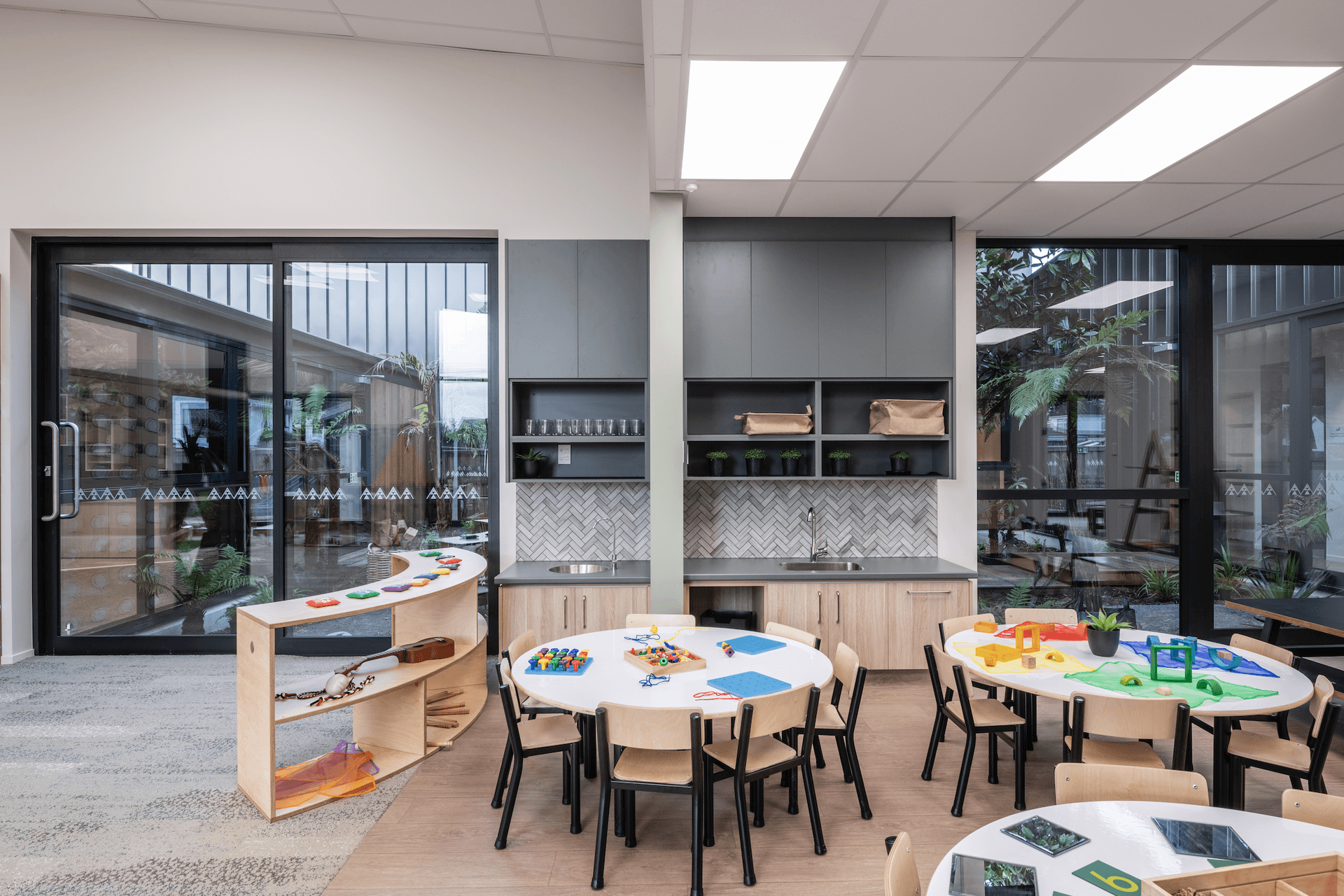 This design coalesces wonder-filled spaces with the daily curriculum to foster an environment that is deliberately crafted to be both aesthetically and intellectually stimulating to a child.
