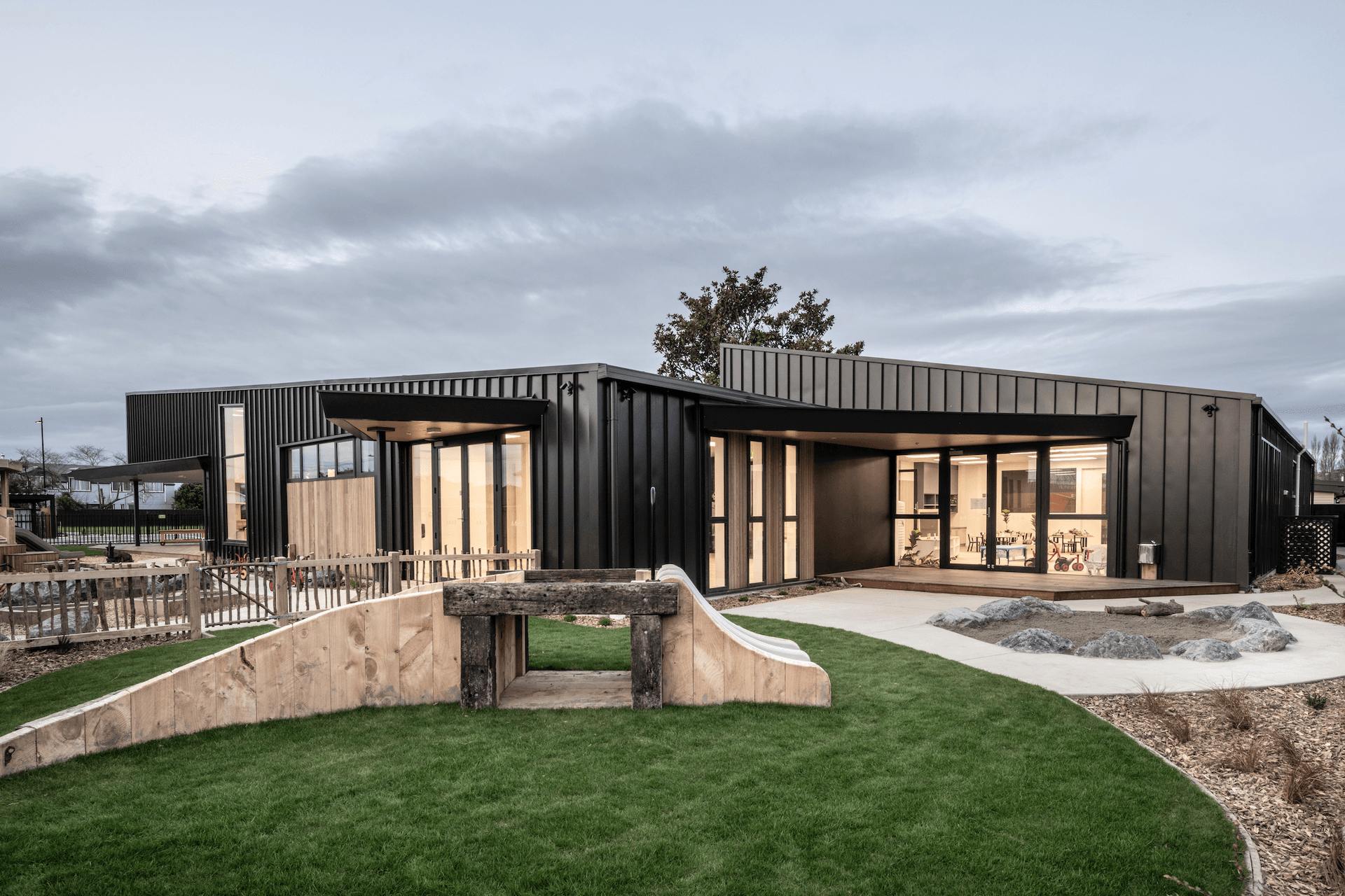 The roof’s horizontal line provides a low profile, offering a protective canopy for each space around the perimeter of the build.