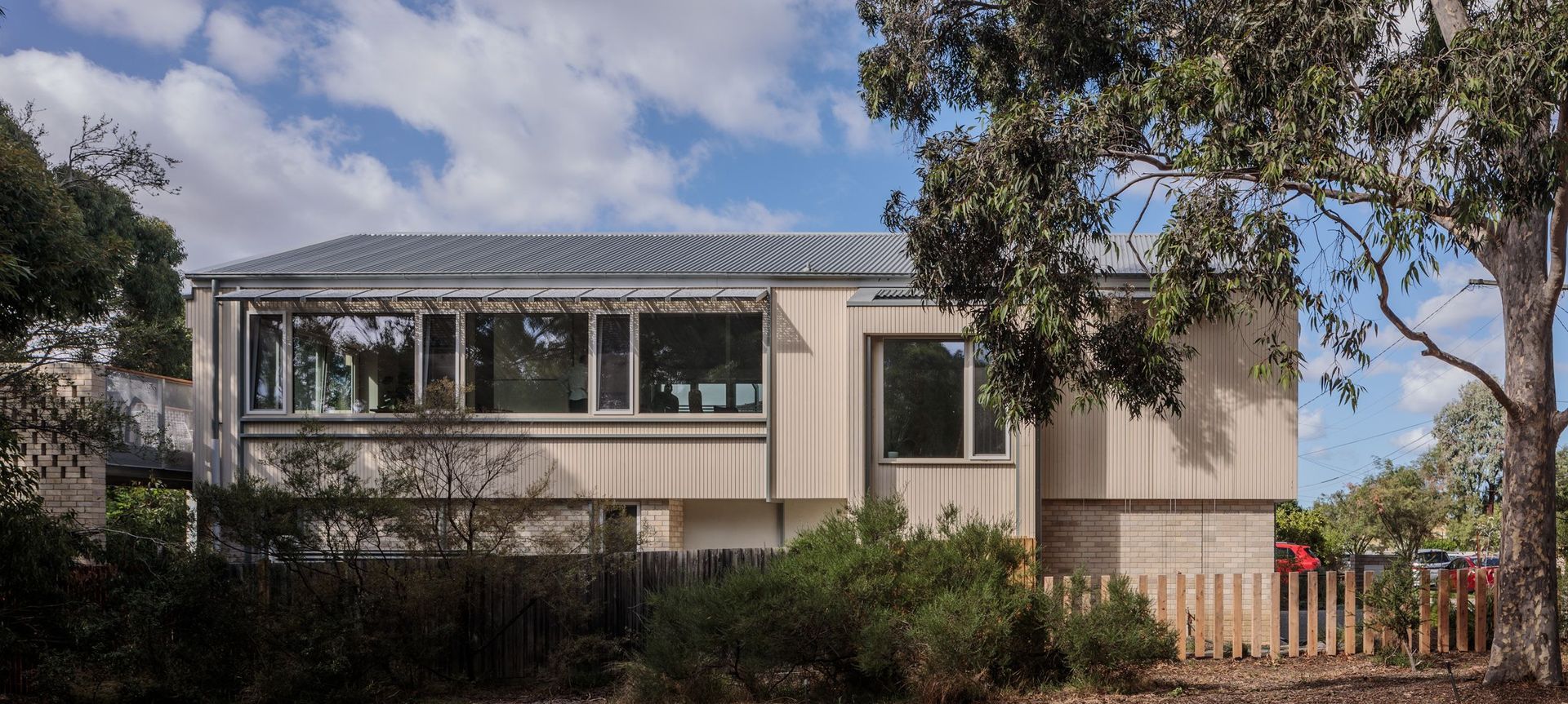 The energy-efficient dwelling was designed to blend in with its natural surroundings, sitting directly opposite green, leafy All Nations Park.