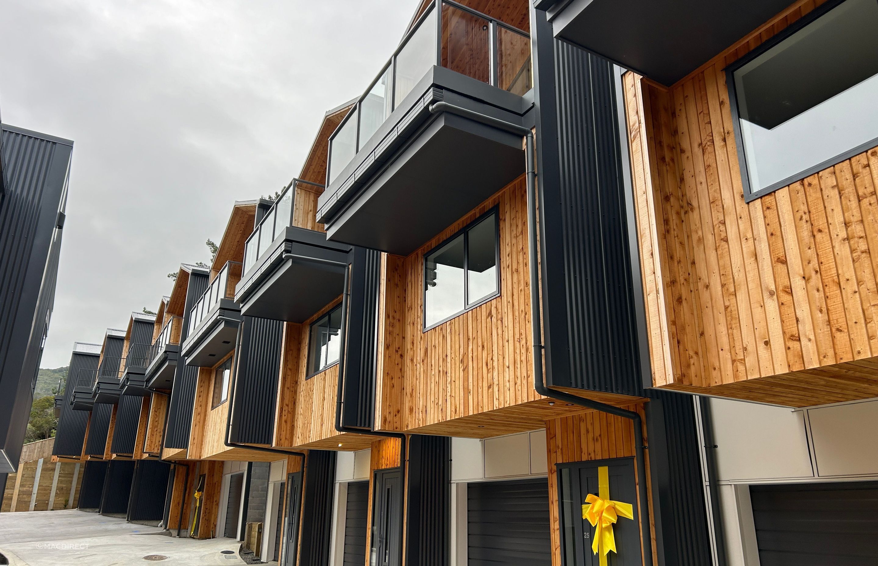 Extensive use of MacDirect's macrocarpa timber softens the exterior façade.