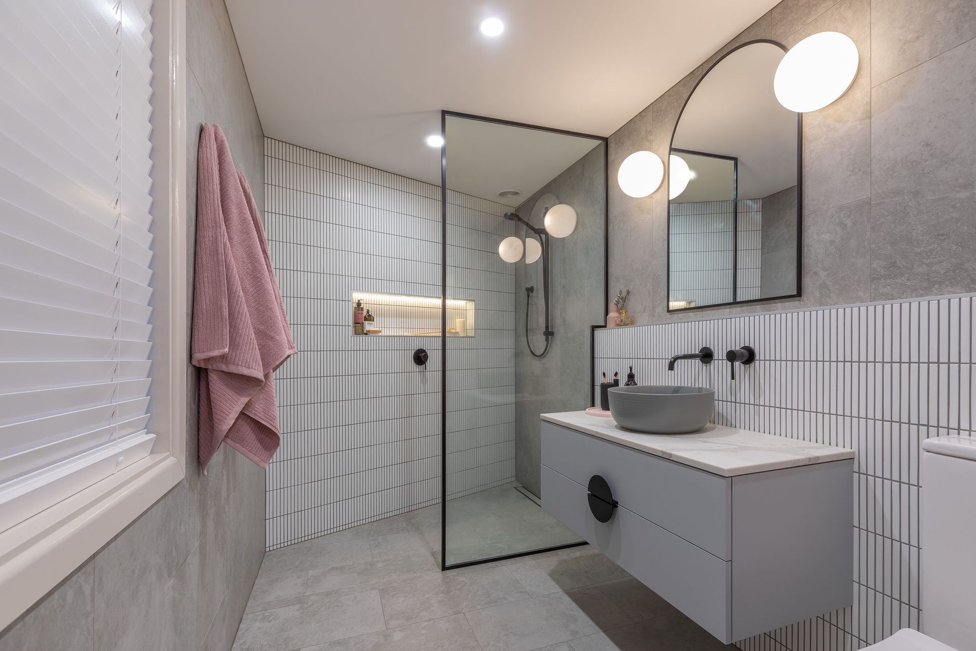 A tiled splashback with a sophisticated vanity is an excellent way to enhance an aesthetic.