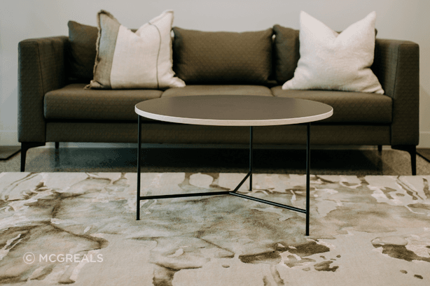 A custom-upholstered Martino sofa offers home comfort, with commercial durability.