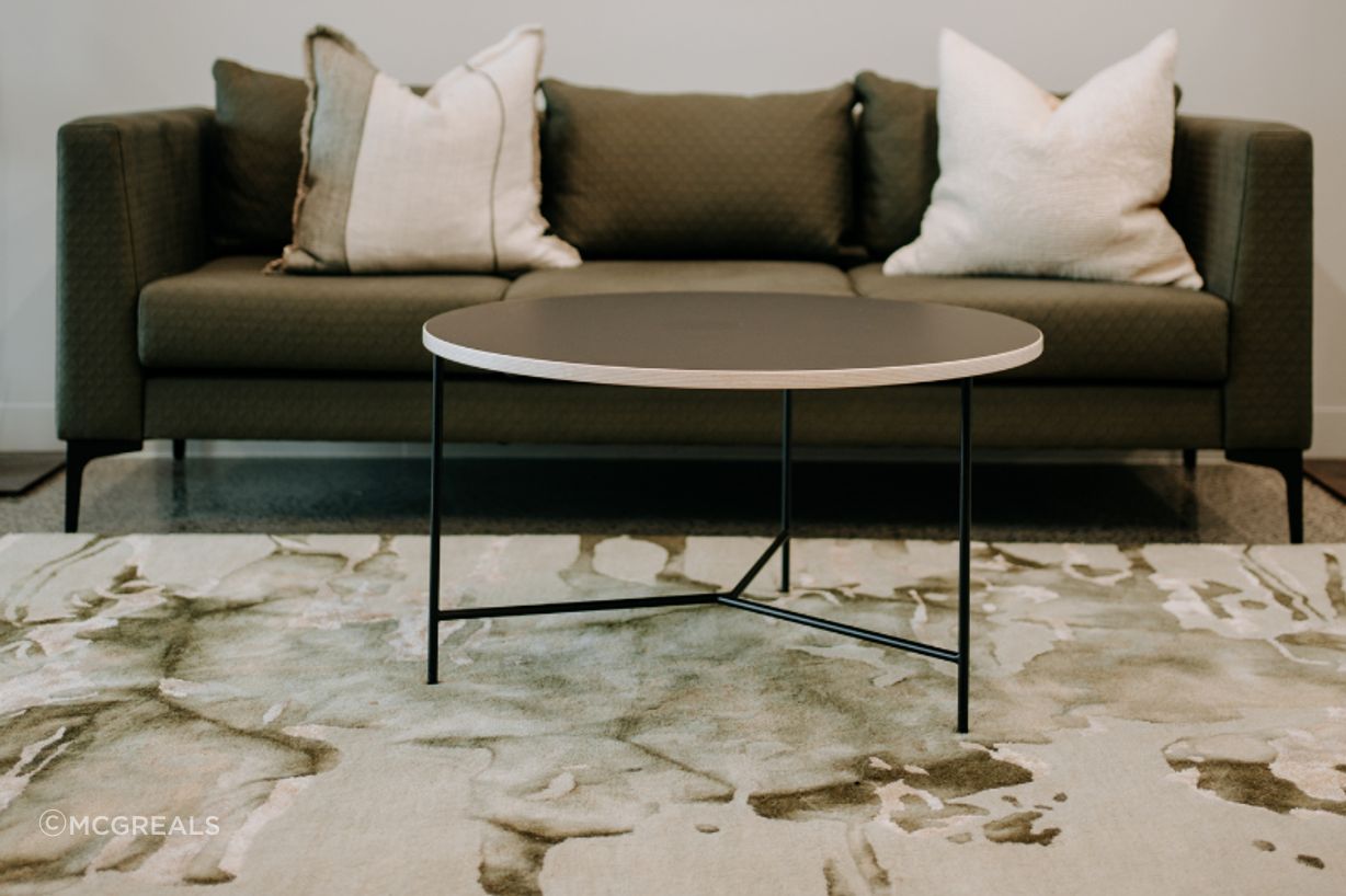 A custom-upholstered Martino sofa offers home comfort, with commercial durability.