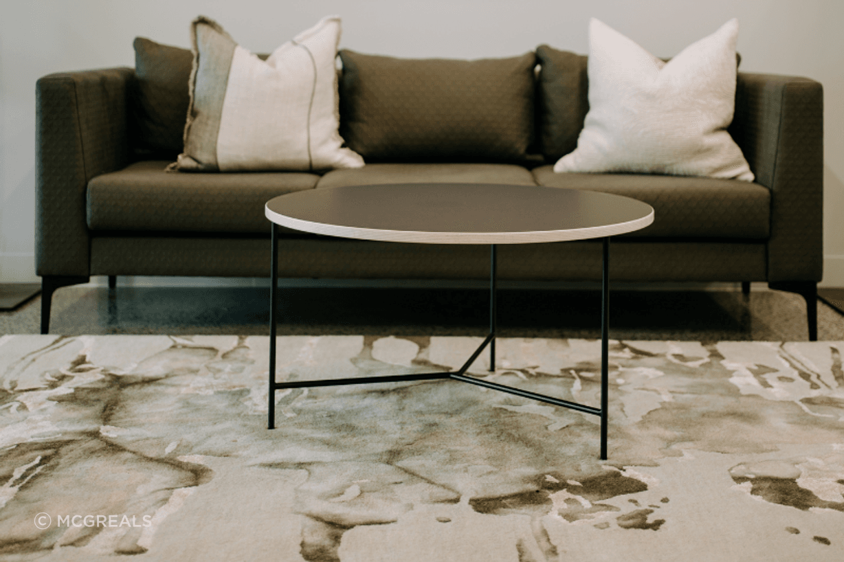 A custom-upholstered Martino sofa offers home comfort, with commercial durability.