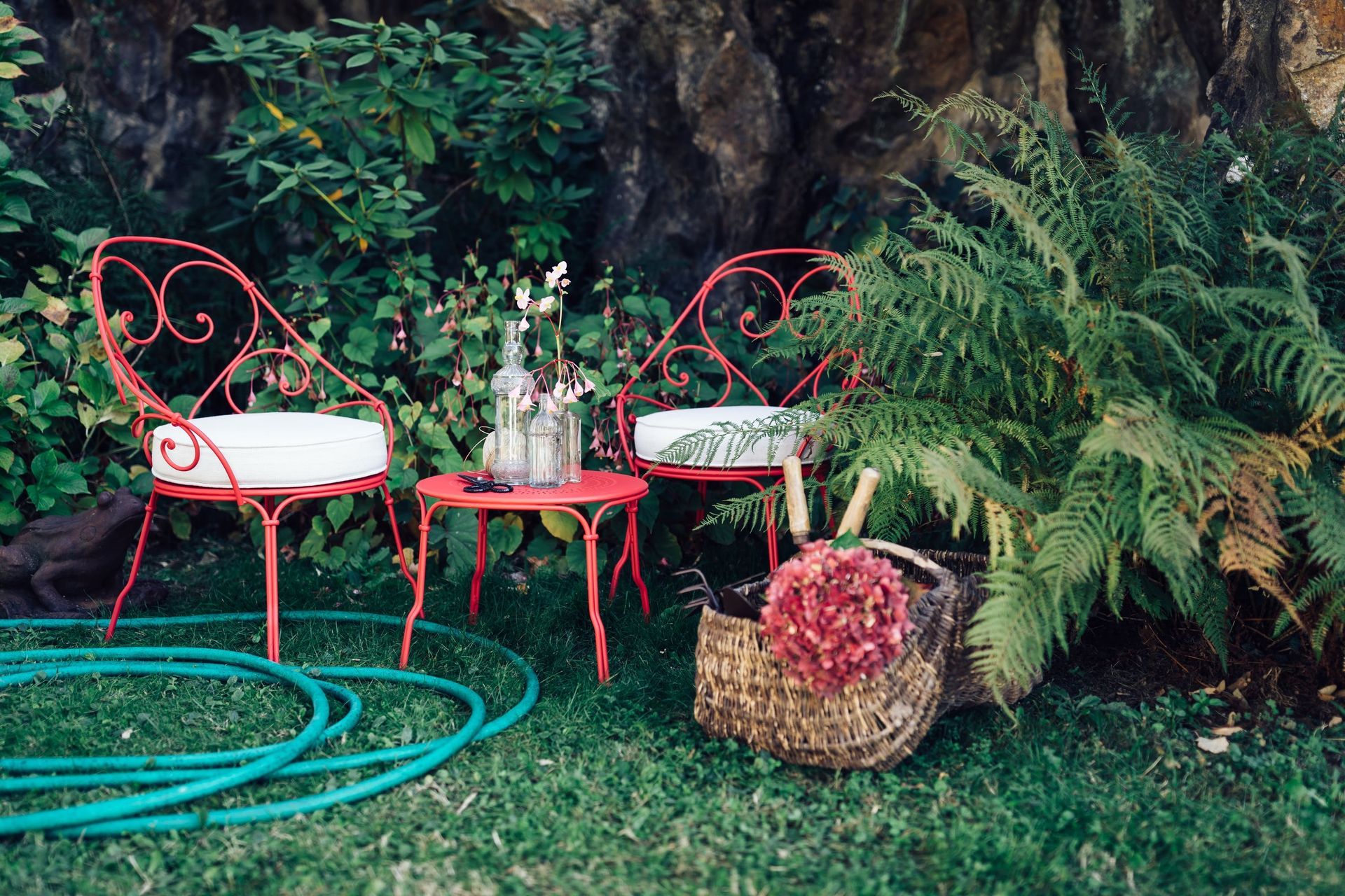 The 1900 Cabriolet Armchair by Fermob exudes an undeniable sense of French charm.