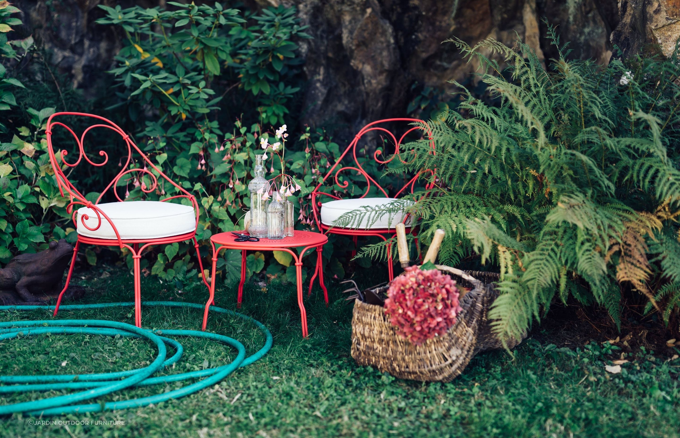 The 1900 Cabriolet Armchair by Fermob exudes an undeniable sense of French charm.