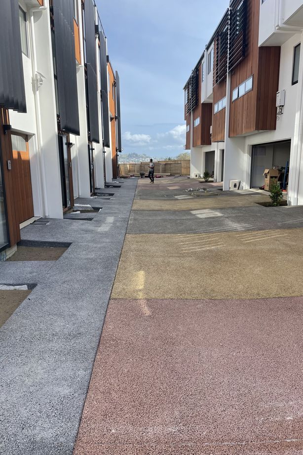 Permeable concrete is made up of stone aggregate, cement, water, and Permcon's special additive. Without a sand filler, the concrete has holes throughout.