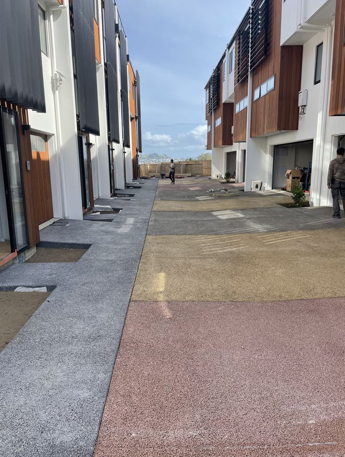 Permeable concrete is made up of stone aggregate, cement, water, and Permcon's special additive. Without a sand filler, the concrete has holes throughout.